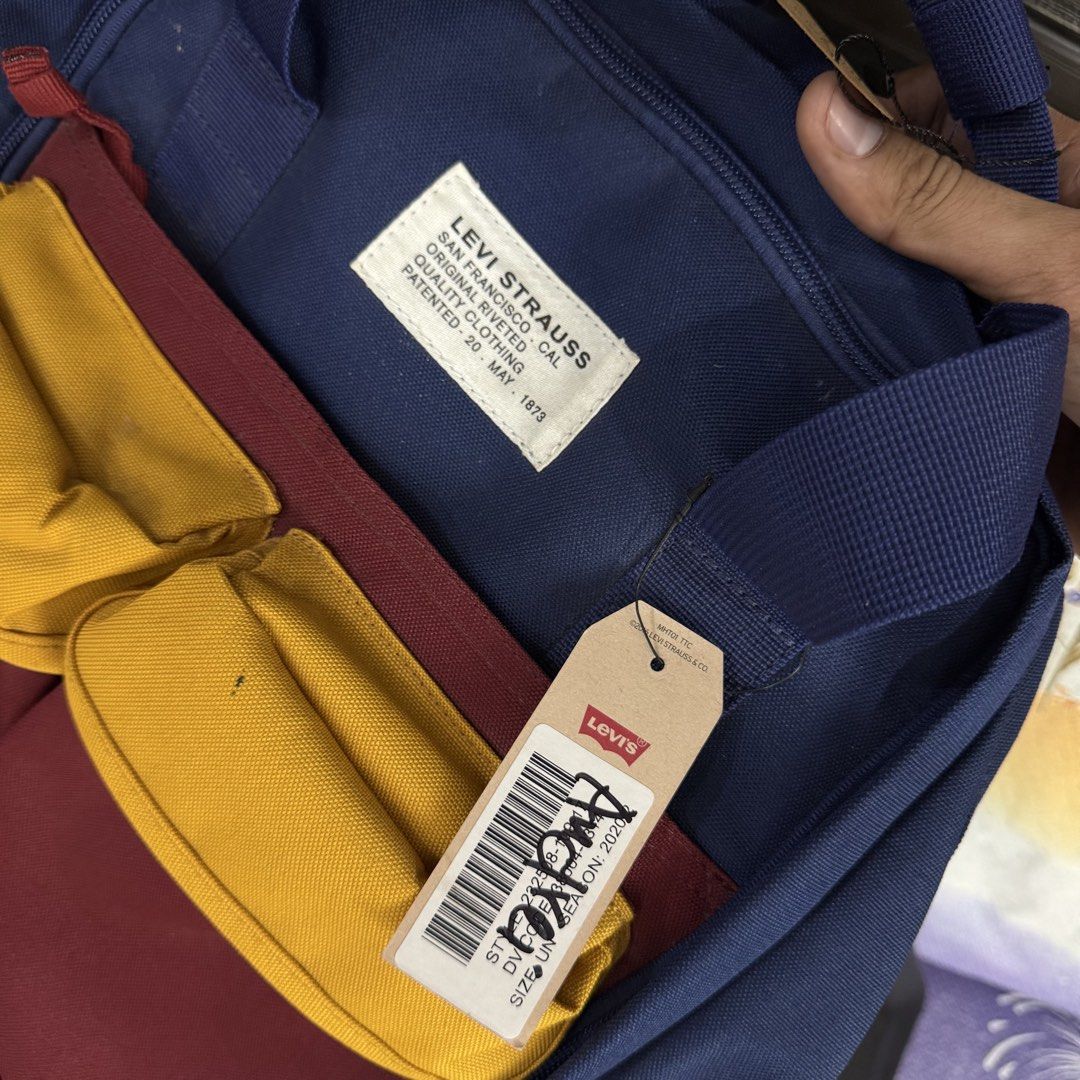 Levi's multicolor backpack with laptop compartment (Category: Backpacks) located in Manila. Submitted by aries.15 (Listing ID 1422371899, Image 3). Description: Levis multi pocket backpack w/ laptop compartment 💕 -brandnew -18 inches height by 16 width -no issue -some part has dirt need wash 2499 only 🌸 .