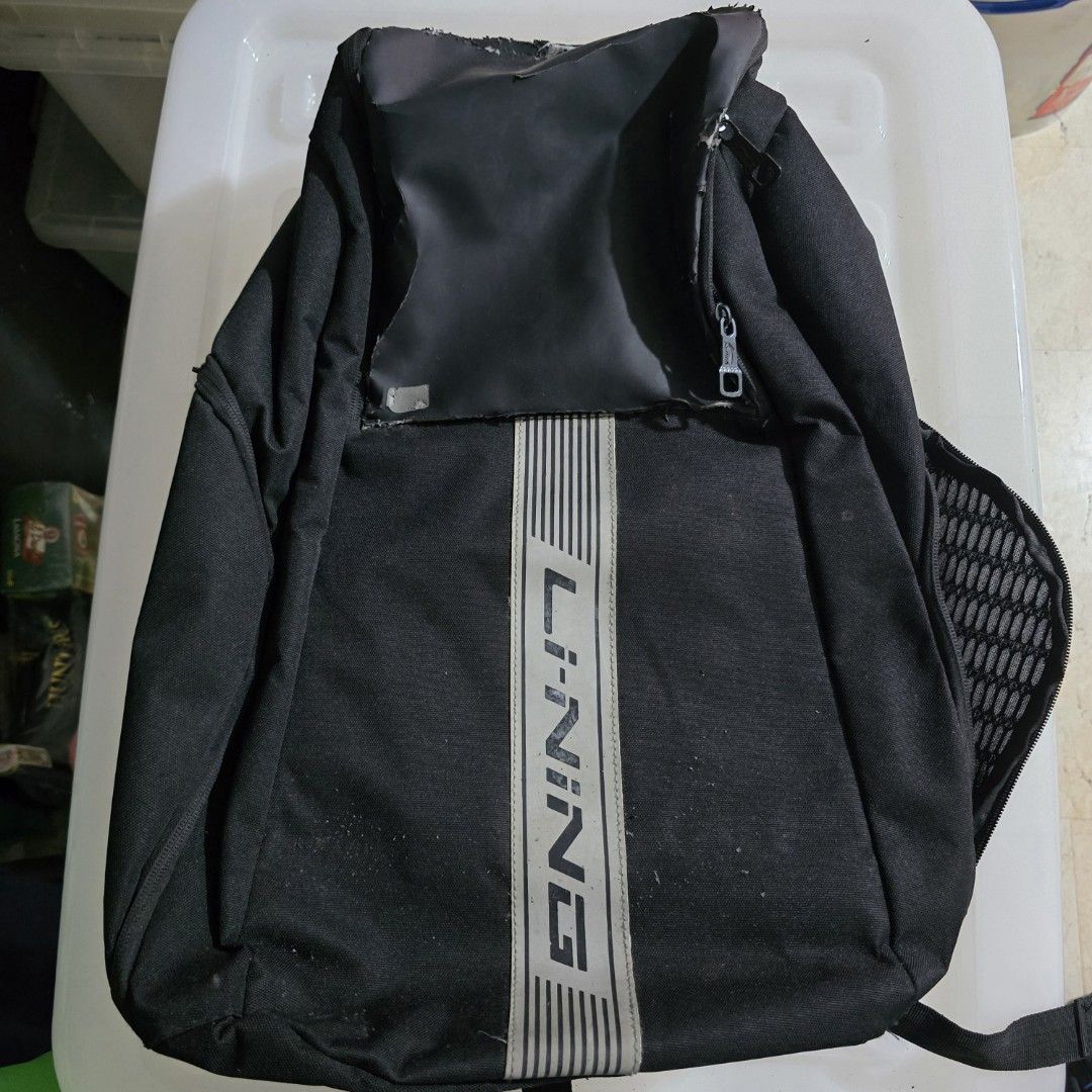 Li-Ning Black Backpack (Category: Backpacks) located in Quezon City. Submitted by ayronjustin (Listing ID 1422256893, Image 1). Description: - Black Li-Ning backpack - Badminton Backpack - Compartment for Racket - Vertical stripe design - Zippered top compartment - Mesh side pocket with shoe compartment - Li-Ning logo on front - Durable fabric - Top handle - Adjustable straps - heavily used and chipping off leather - rush sale very negotiable.