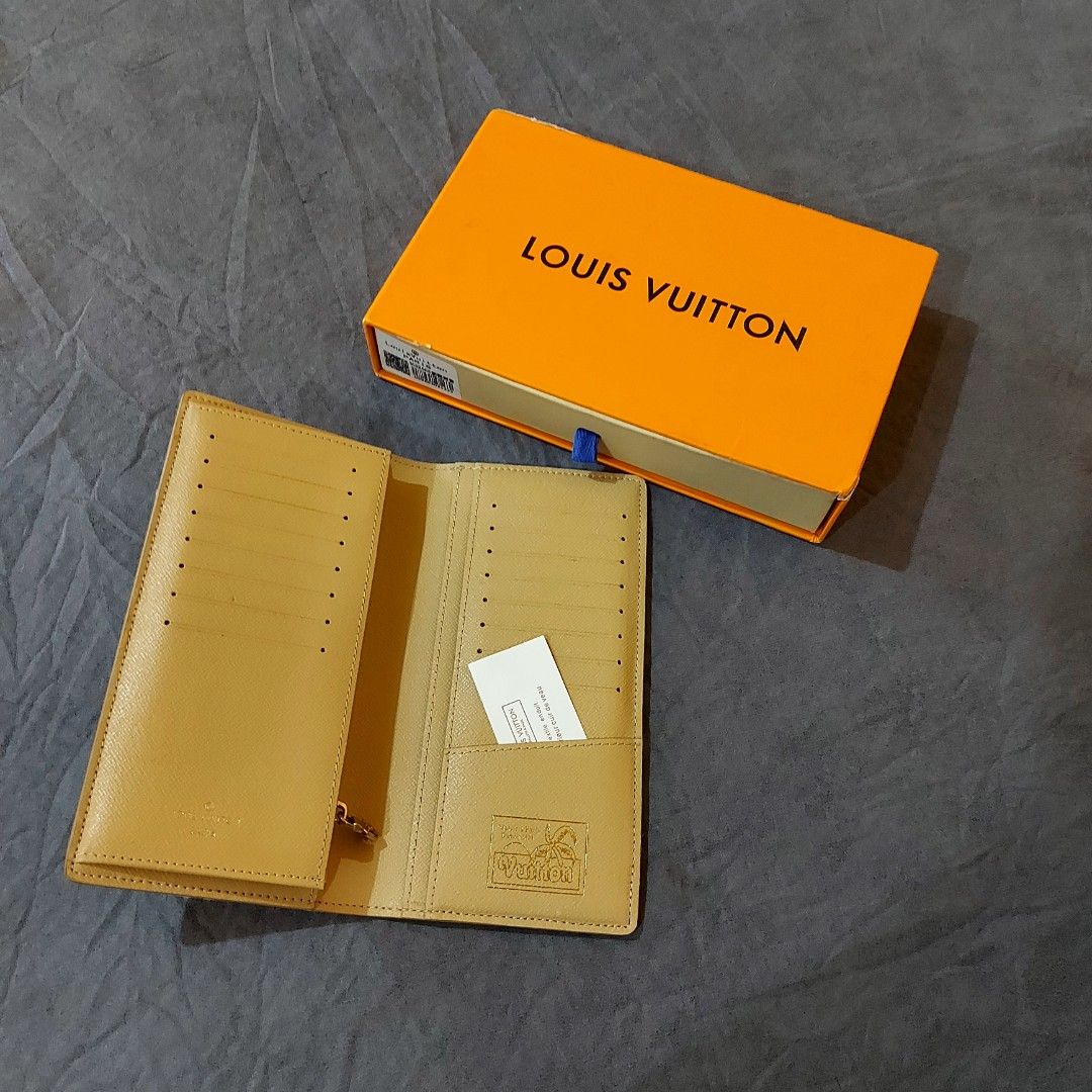 Louis Vuitton Long Wallet (Category: Luxury Bags & Wallets) located in La Trinidad. Submitted by marksols (Listing ID 1422241862, Image 3). Description: - Louis Vuitton long wallet - Unique floral and palm tree design - Comes with original box - Multiple card slots - Zippered coin compartment - Perfect for everyday use.
