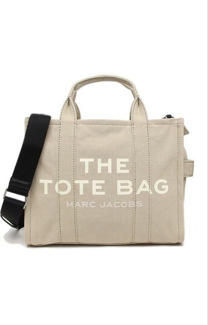 Marc Jacobs The Tote Bag (Category: Luxury Bags & Wallets) located in Bacoor. Submitted by 9gee9 (Listing ID 1422304993, Image 1). Description: - Authentic Marc Jacobs The Tote Bag - Neutral beige color - Medium size - Top handle and detachable shoulder strap - Secure zipper closure - Interior pocket for organization - Signature Marc Jacobs logo - Crafted from durable canvas material - Price negotiable for sure buyer - RFS: decluttering.