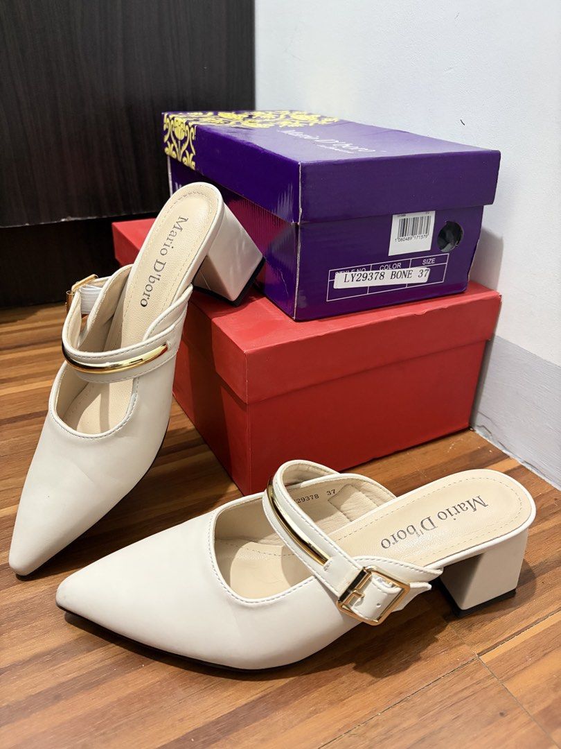 Mario D'boro Bone Mules Size 37 kitten heels (Category: Flats & Sandals) located in Manila. Submitted by hihihihi777 (Listing ID 1422307222, Image 2). Description: - used once only Mario D'boro mules - Color: Bone - Size: 37 - Features: Pointed toe, strap and buckle detail, block heel - Condition: Good.