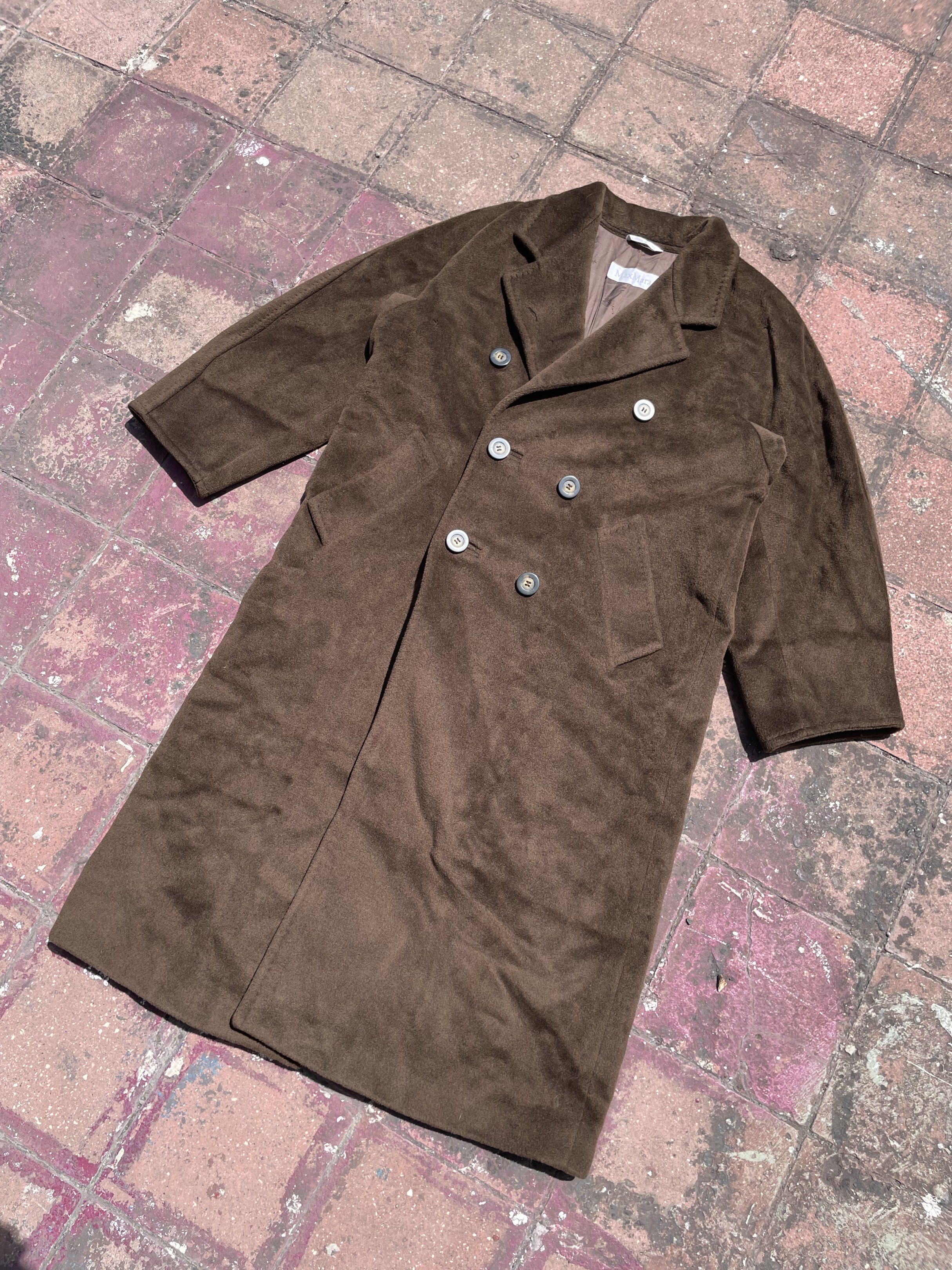 Max Mara Brown Wool Trench Coat (Category: Luxury Apparel) located in Taguig. Submitted by highlows (Listing ID 1422300548, Image 2). Description: - Max Mara double-breasted coat - Rich brown color - Classic design with notched lapel - Made in Italy - Satin lining - Size: US 6, UK 8, IT 40 - Minor imperfections (small holes).
