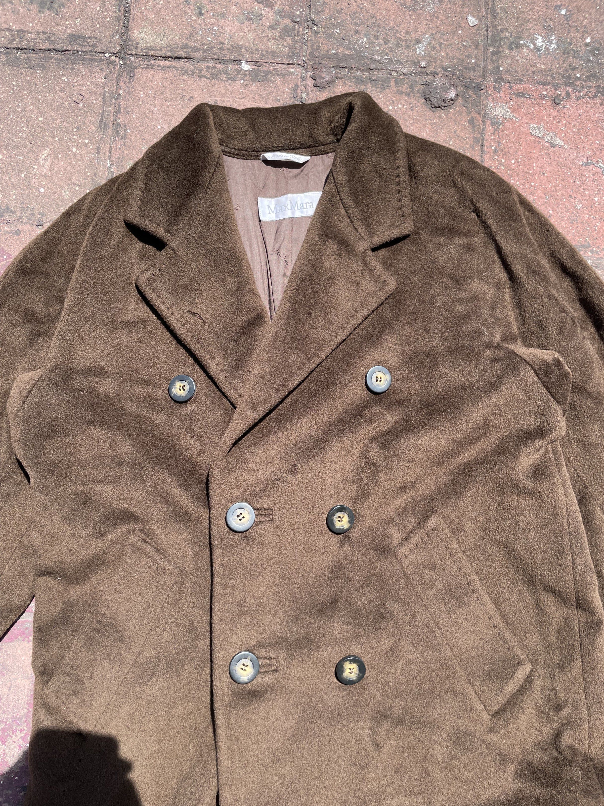 Max Mara Brown Wool Trench Coat (Category: Luxury Apparel) located in Taguig. Submitted by highlows (Listing ID 1422300548, Image 3). Description: - Max Mara double-breasted coat - Rich brown color - Classic design with notched lapel - Made in Italy - Satin lining - Size: US 6, UK 8, IT 40 - Minor imperfections (small holes).