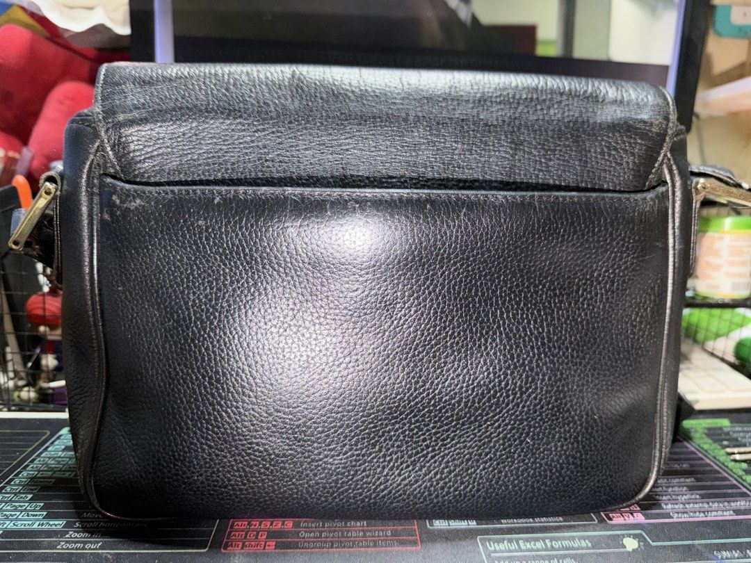 MCM Black Shoulder Bag (Category: Luxury Bags & Wallets) located in Taytay. Submitted by jp4_fashion_hub (Listing ID 1422368075, Image 2). Description: - Black MCM shoulder bag - Flap closure with gold-tone logo - Adjustable long strap - Interior zipper pocket and logo tag - Exterior shows some wear - Made of textured leather.