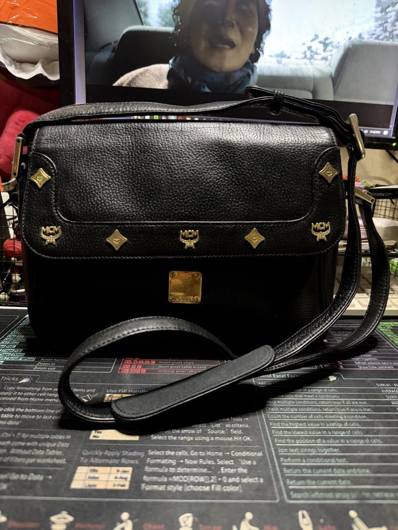 MCM Black Shoulder Bag (Category: Luxury Bags & Wallets) located in Taytay. Submitted by jp4_fashion_hub (Listing ID 1422368075, Image 1). Description: - Black MCM shoulder bag - Flap closure with gold-tone logo - Adjustable long strap - Interior zipper pocket and logo tag - Exterior shows some wear - Made of textured leather.