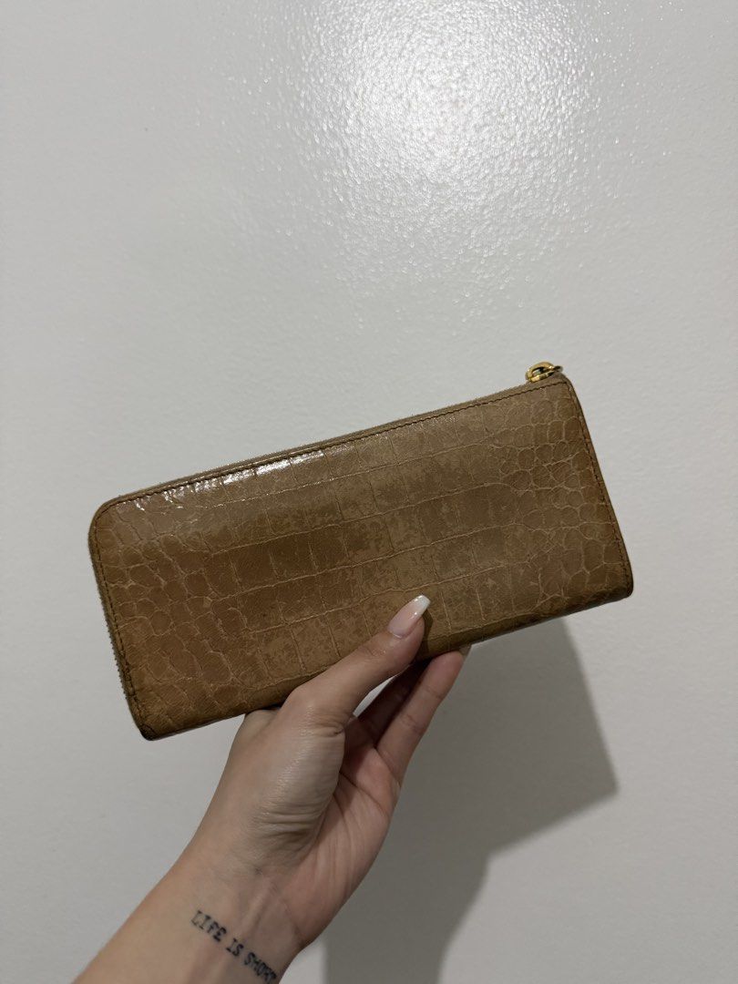 Miu Miu Crocodile Embossed Zip Wallet (Category: Luxury Bags & Wallets) located in Cainta. Submitted by bagsfromdara (Listing ID 1422249114, Image 2). Description: - Miu Miu Crocodile Embossed Zip Wallet - Features a stylish crocodile embossed design - Zip closure for security - Beautiful color - A perfect accessory for any occasion.