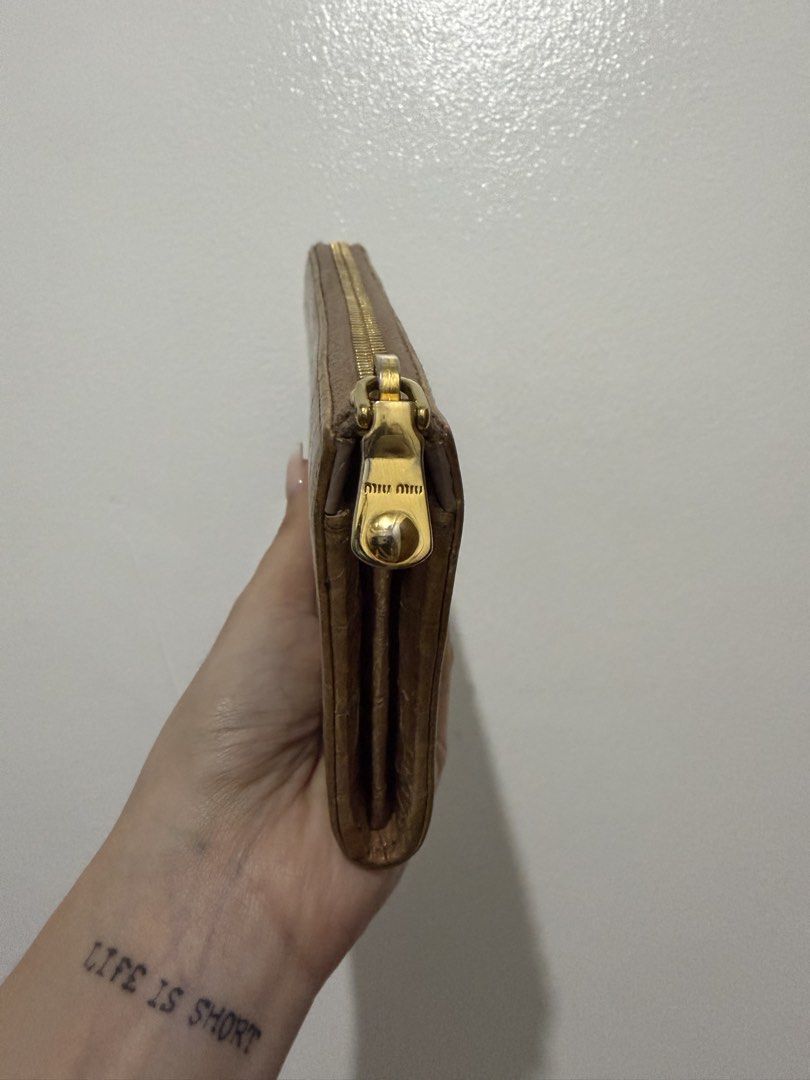 Miu Miu Crocodile Embossed Zip Wallet (Category: Luxury Bags & Wallets) located in Cainta. Submitted by bagsfromdara (Listing ID 1422249114, Image 3). Description: - Miu Miu Crocodile Embossed Zip Wallet - Features a stylish crocodile embossed design - Zip closure for security - Beautiful color - A perfect accessory for any occasion.