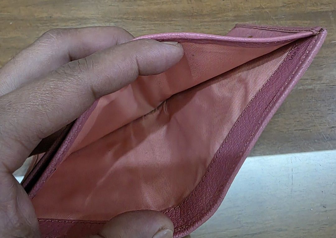 Miu Miu Pink Leather Wallet (Category: Luxury Bags & Wallets) located in Quezon City. Submitted by lifestyleboutik (Listing ID 1422280893, Image 2). Description: Miu Miu wallet is in a lovely pink color. It features multiple card slots and a coin compartment. The wallet has a snap closure. The dimensions are approximately 4 inches in width and 3 inches in height. The interior lining is a matching pink fabric. Coded Genuine leather Perfect for sma