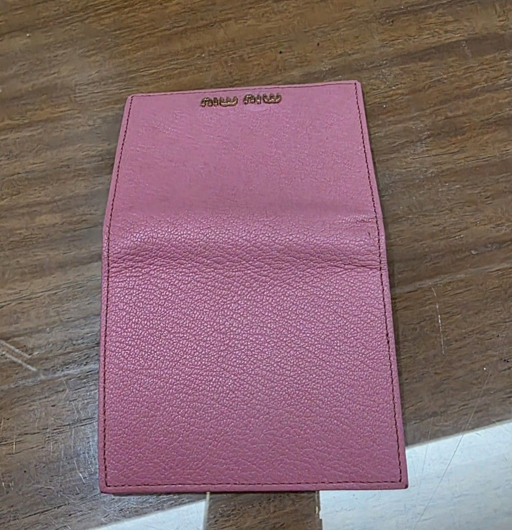 Miu Miu Pink Leather Wallet (Category: Luxury Bags & Wallets) located in Quezon City. Submitted by lifestyleboutik (Listing ID 1422280893, Image 3). Description: Miu Miu wallet is in a lovely pink color. It features multiple card slots and a coin compartment. The wallet has a snap closure. The dimensions are approximately 4 inches in width and 3 inches in height. The interior lining is a matching pink fabric. Coded Genuine leather Perfect for sma