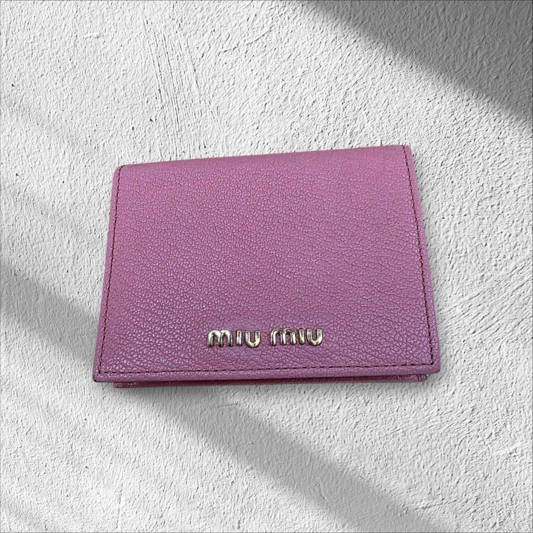Miu Miu Pink Leather Wallet (Category: Luxury Bags & Wallets) located in Quezon City. Submitted by lifestyleboutik (Listing ID 1422280893, Image 1). Description: Miu Miu wallet is in a lovely pink color. It features multiple card slots and a coin compartment. The wallet has a snap closure. The dimensions are approximately 4 inches in width and 3 inches in height. The interior lining is a matching pink fabric. Coded Genuine leather Perfect for sma