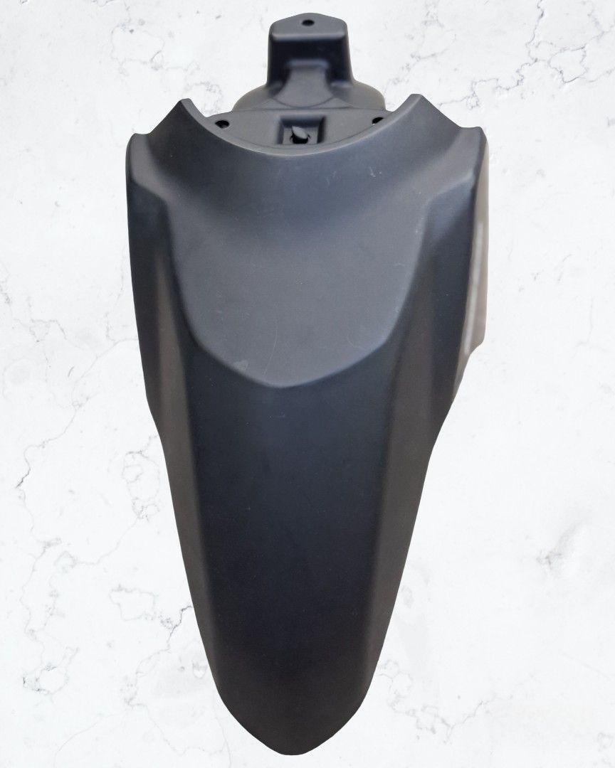 Motorcycle Front Fender with Combi Brake (Category: Body Parts and Accessories) located in Tarlac. Submitted by chiefnaticz2020 (Listing ID 1422344758, Image 2). Description: - Black front fender for motorcycles - Features 'Combi Brake' label - Made of durable plastic - Unique shape with multiple curves and angles - Includes mounting points for easy installation - Designed to protect your front wheel from debris.
