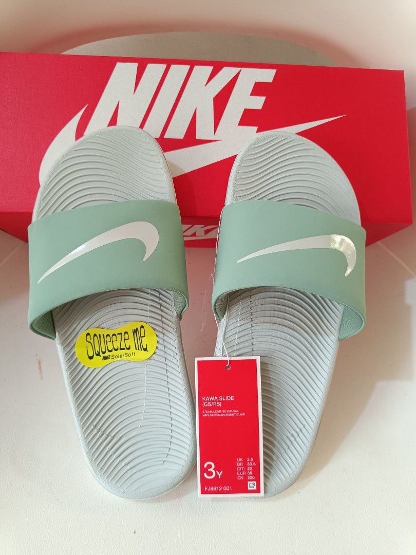 Nike Kawa Slide Sandals 3Y (Category: Babies & Kids Fashion) located in Cavite. Submitted by disyc (Listing ID 1422381819, Image 1). Description: Nike Kawa Slide sandals in mint green. Features the Nike swoosh logo on the strap. Includes the original box and tags. Size 3Y. The sandals have a textured footbed for comfort and grip. Perfect for everyday wear or after sports activities..