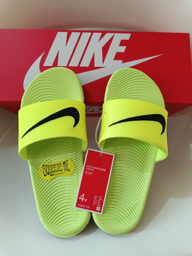 Nike Kawa Slide Sandals - 4Y (Category: Babies & Kids Fashion) located in Cavite. Submitted by disyc (Listing ID 1422381772, Image 1). Description: - Authentic Nike Kawa Slide sandals - Neon green color - Size: 4Y - Includes original box and tags - Features Nike swoosh logo - Textured footbed for comfort - Durable sole for grip - Ideal for casual wear and post-sports activities.