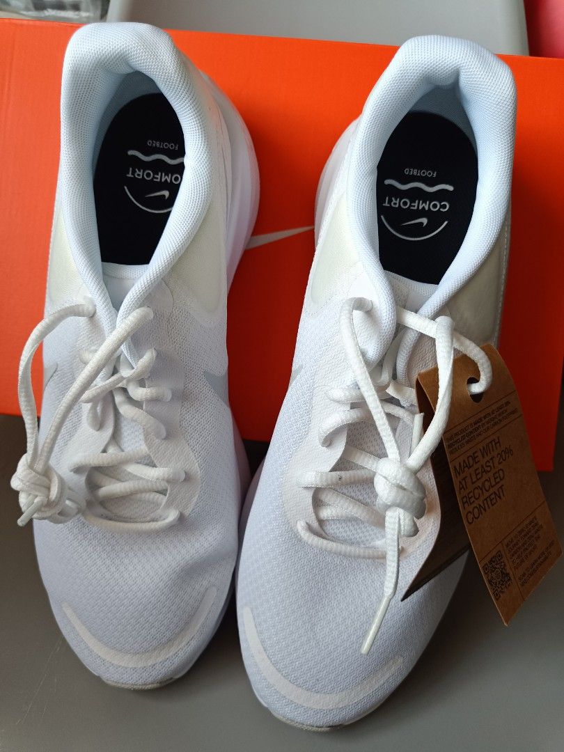 Nike Revolution 7 White Sneakers (Category: Sneakers) located in Cavite. Submitted by disyc (Listing ID 1422307668, Image 1). Description: - Nike Revolution 7 sneakers - Color: White - Size: 11.5 US / 10.5 UK / 43.5 EUR - Includes original box and tags - Made with at least 20% recycled content.