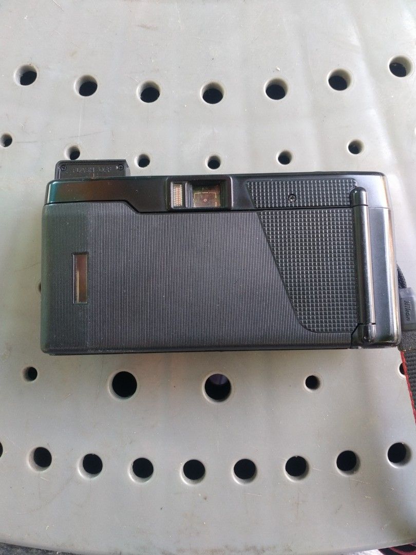 Nikon L35AF 35mm Film Camera (Category: Cameras) located in Tanza. Submitted by dr53_ (Listing ID 1422243637, Image 3). Description: [Untested item. Buy at your own risk. Price Negotiable.] - Nikon L35AF 35mm film camera - Built-in flash - 35mm lens - Fully automatic operation - ASA/ISO setting - Flash mode selector - Includes camera strap.