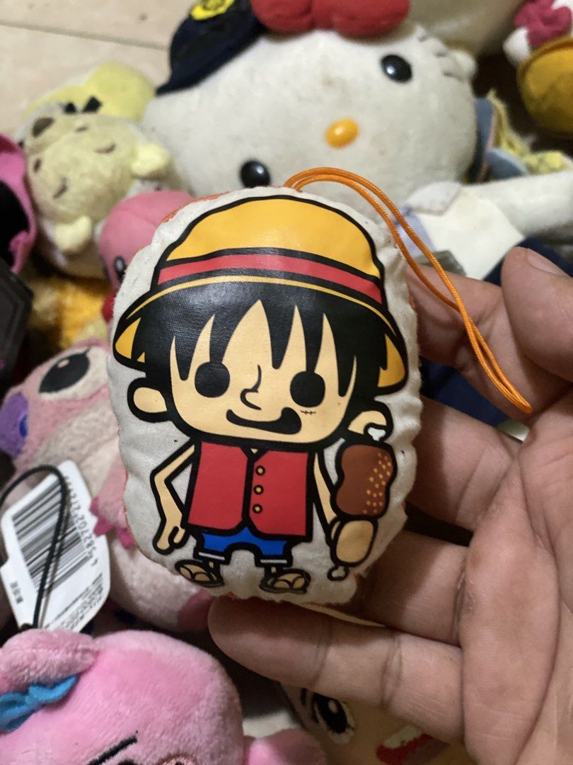One Piece Luffy Keychain (Category: Character Goods) located in Manila. Submitted by kuya_moto (Listing ID 1422322276, Image 1). Description: - Luffy keychain from One Piece! - Features Luffy with his yellow hat, red vest, and blue shorts. - Includes a piece of meat. - Comes with an orange string for easy hanging. - Perfect for One Piece enthusiasts!.