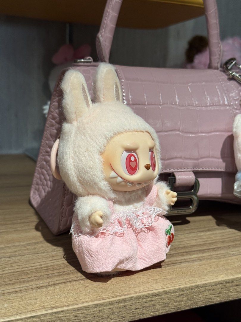 Pop Mart Labubu Have a Seat DADA (Category: Designer & Blind Box Toys) located in San Juan City. Submitted by nikkakelly (Listing ID 1422357914, Image 2). Description: - like new condition, no damages - no more box or inclusions - pink cherry dress included 🍒 - 100% authentic Loc: West Ave., Quezon City Ships via J&T, Lalamove, Grab.