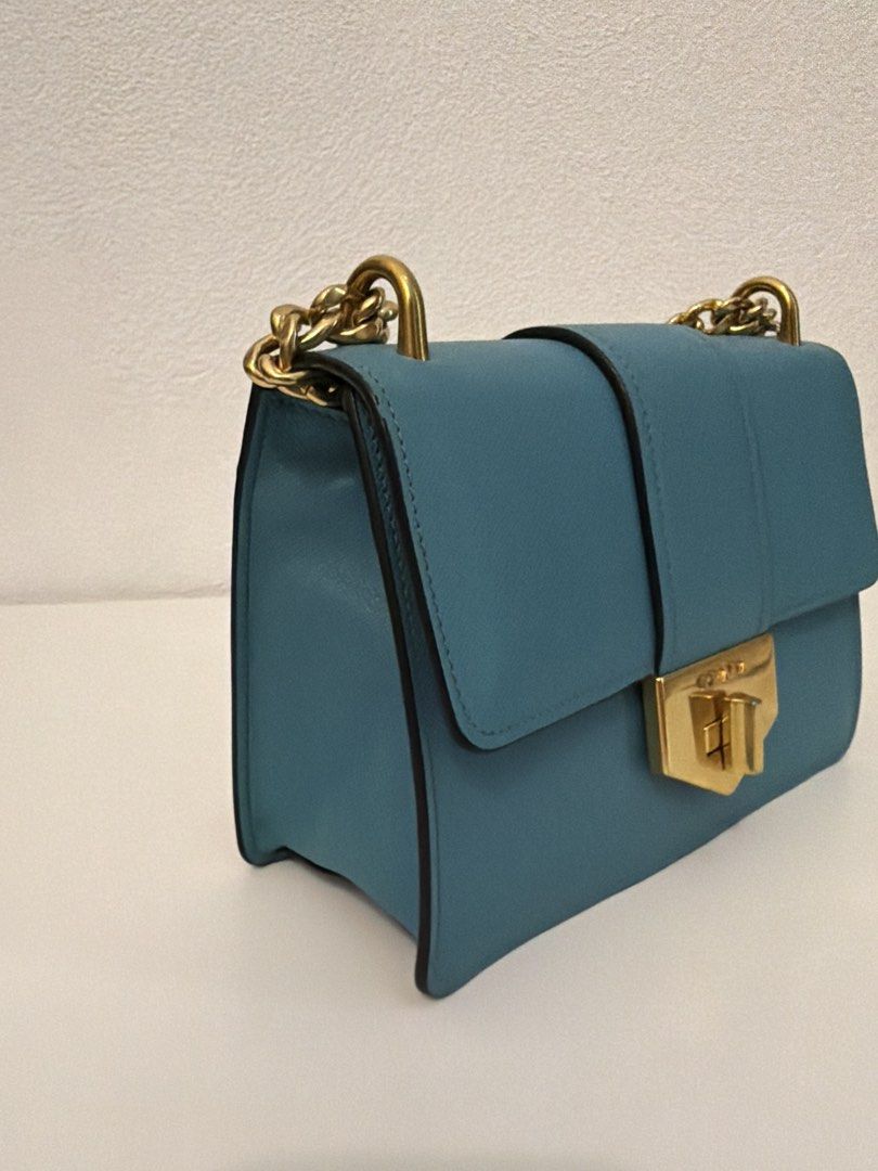Prada Diagramme Shoulder Bag (Category: Luxury Bags & Wallets) located in Manila. Submitted by justabagxoxo (Listing ID 1422278241, Image 3). Description: - Prada Diagramme shoulder bag - Stunning teal color - Elegant gold-tone hardware - Stylish chain strap - Secure flap closure with Prada logo - Luxurious teal leather interior - Structured shape - Versatile for everyday or special events .