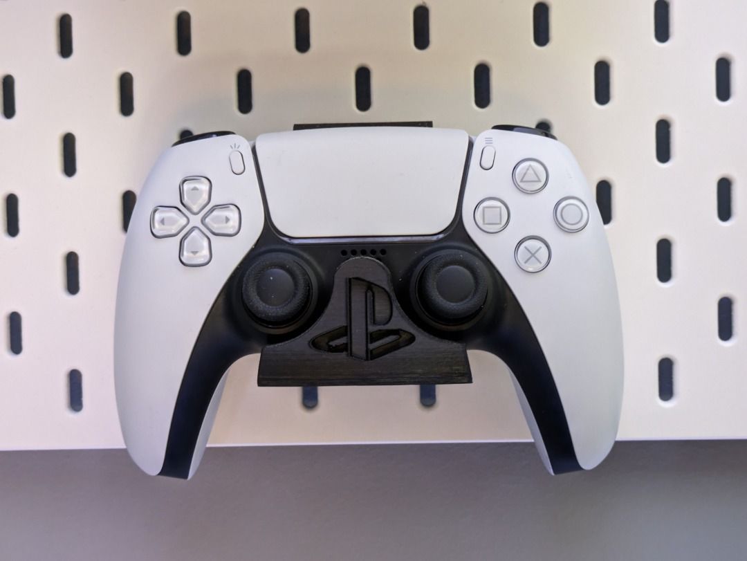 PS5 Controller Mount for IKEA Skadis | Custom Pegboard Holder | Minimalist Design (Category: Controllers) located in Mandaluyong City. Submitted by heyitslaaaance (Listing ID 1422236546, Image 1). Description: Organize your gaming wall with this custom-fit PS5 Controller Mount for the IKEA Skadis Pegboard. This holder is precision-engineered to match the curves of the DualSense Wireless Controller, ensuring it sits securely without wobbling or sl