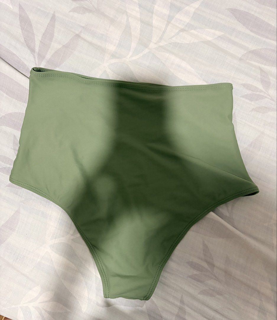 SHEIN High-Waisted Bikini Bottom - Olive Green (Category: Bikinis & Swimsuits) located in Manila. Submitted by tamia444_ (Listing ID 1422354301, Image 2). Description: - Olive green high-waisted bikini bottom - Ruched design on the front - Smooth and stretchy fabric - Full coverage back - Perfect for beach or pool.
