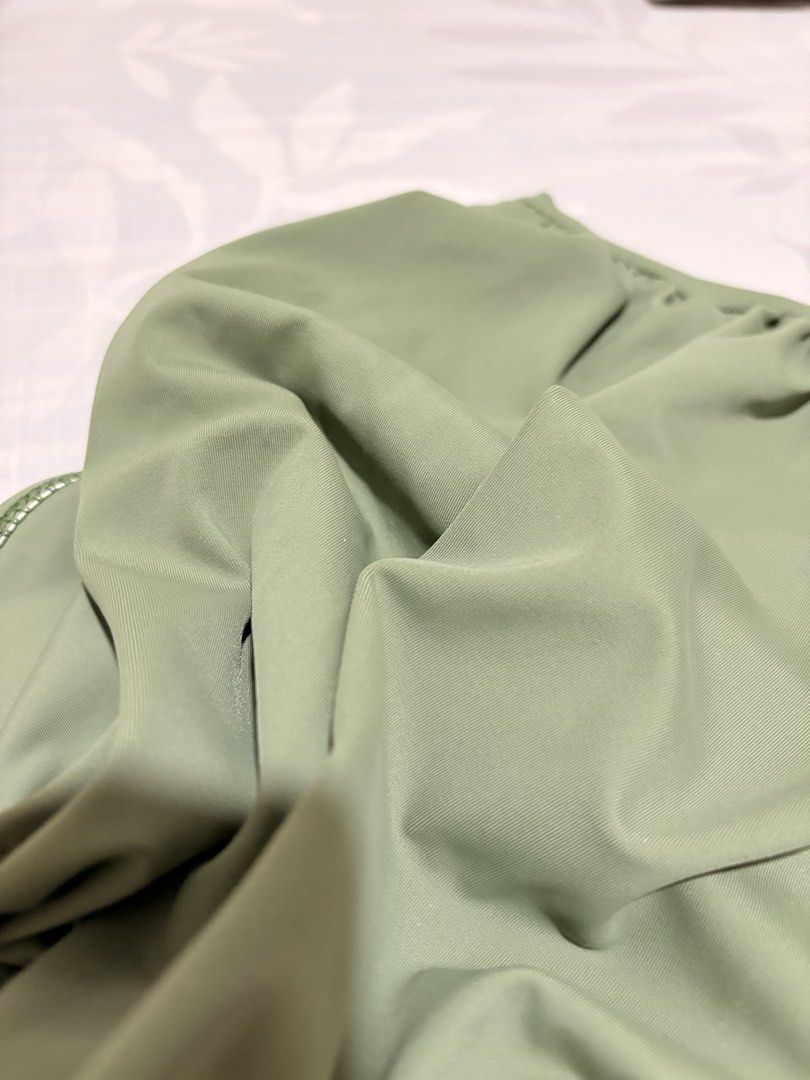SHEIN High-Waisted Bikini Bottom - Olive Green (Category: Bikinis & Swimsuits) located in Manila. Submitted by tamia444_ (Listing ID 1422354301, Image 3). Description: - Olive green high-waisted bikini bottom - Ruched design on the front - Smooth and stretchy fabric - Full coverage back - Perfect for beach or pool.