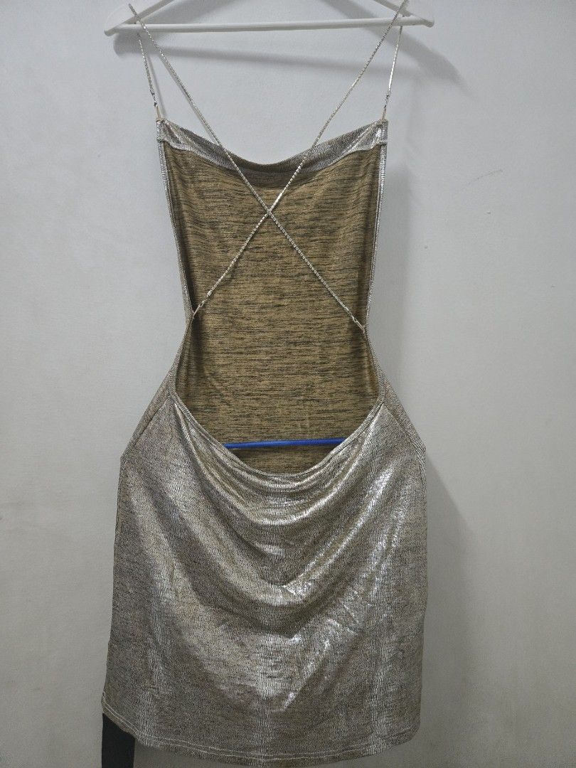 Silver Metallic Dress (Category: Dresses) located in Manila. Submitted by snowbhelle23 (Listing ID 1422290148, Image 1). Description: Pre loved Brand new w/TAG - Silver metallic fabric - Criss-cross back design - Scoop neckline - Sleeveless - Mini dress - Great for parties and special occasions Please manage your expectations.. No Return, No exchange Thank you so much...