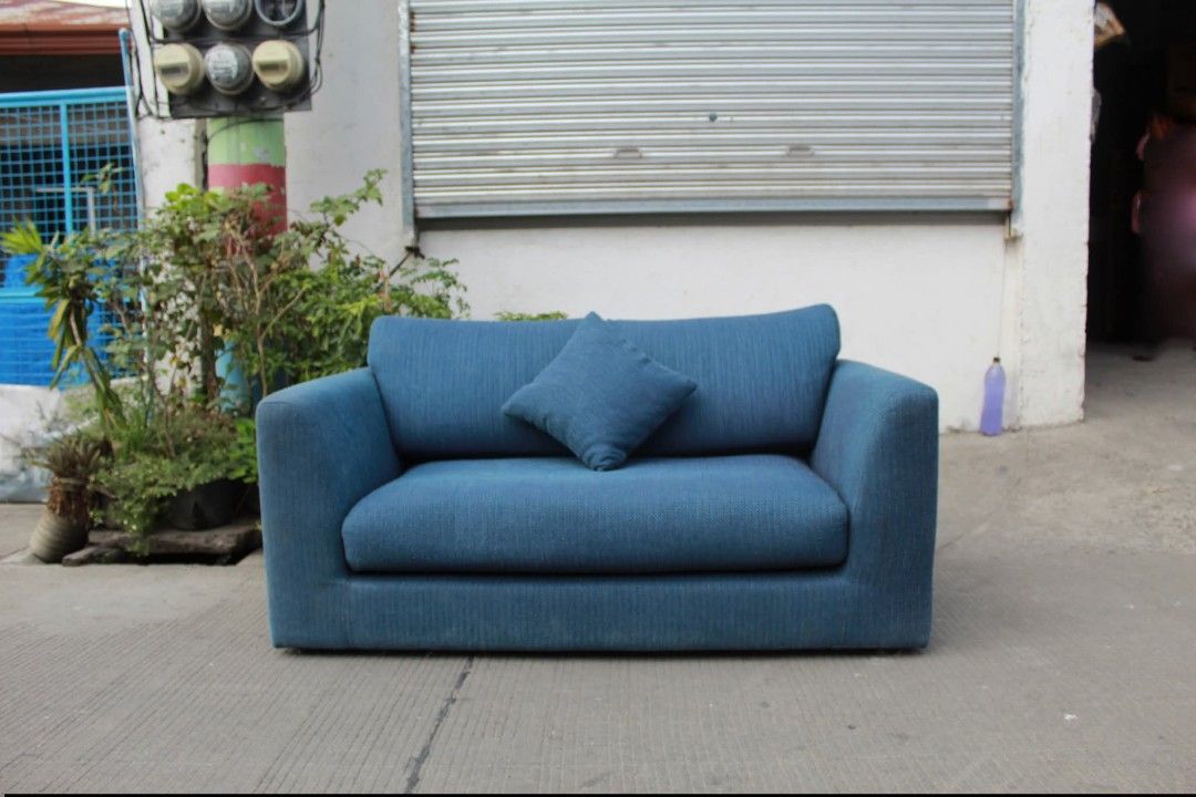 Sofa (Category: Sofas) located in Meycauayan. Submitted by marygracecasimiro (Listing ID 1422362965, Image 3). Description: Two-Seater Loveseat Sofa Compact and comfortable 2-seater sofa upholstered in textured dark blue fabric, low-profile design with squared armrests and thick cushions, perfect for small living spaces L:56 • W:33 • Seat H:11 • Back H:29 inches 12,600 pesos only💚.