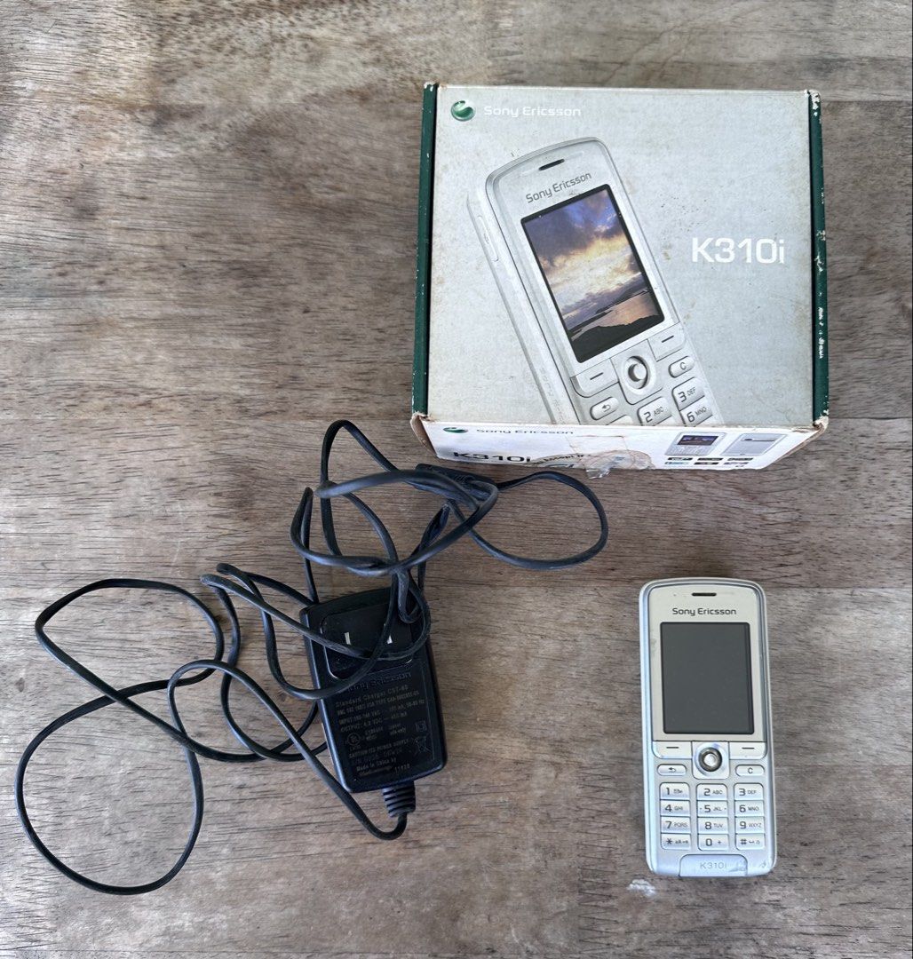 Sony Ericsson K310i Mobile Phone (Category: Early Generation Mobile Phones) located in Mandaluyong City. Submitted by collectorsobsessions (Listing ID 1422333335, Image 1). Description: - Phone comes with a charger and box. - With some scratches at the bottom. - Untested and no guarantees that it works. - However, when charger was tested, the red light on top of the phone lit up. - Comes as is, what you see is what you get. - Perfect for collecto