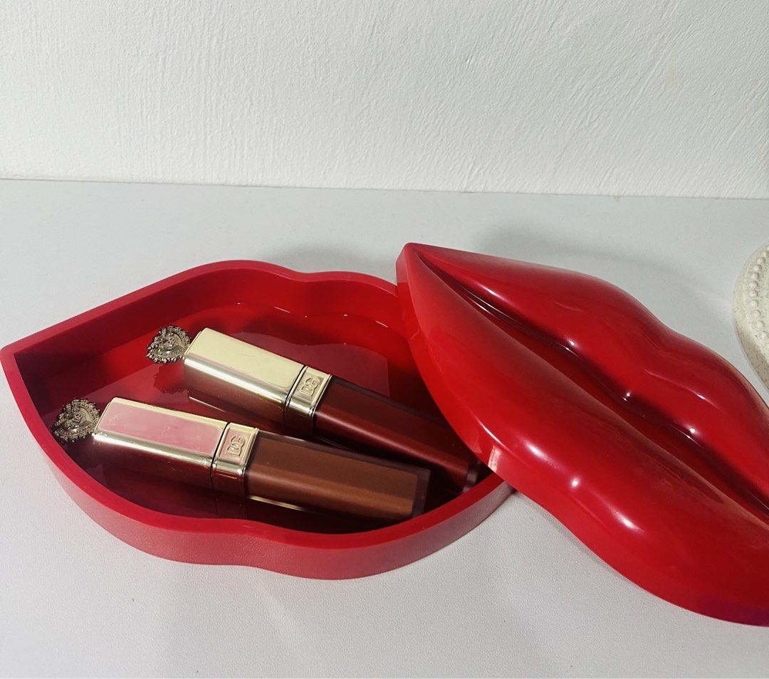 Strokes Red Lips Shaped Storage Box (Category: Storage Boxes & Baskets) located in Quezon City. Submitted by klawdeclutteeeeerr (Listing ID 1422278690, Image 3). Description: - Unique storage box shaped like red lips - Spacious interior for makeup, jewelry, or small items - Made of glossy red material - Smooth finish - Stylish and functional design - Adds a pop of color to any space - Decorative and practical.