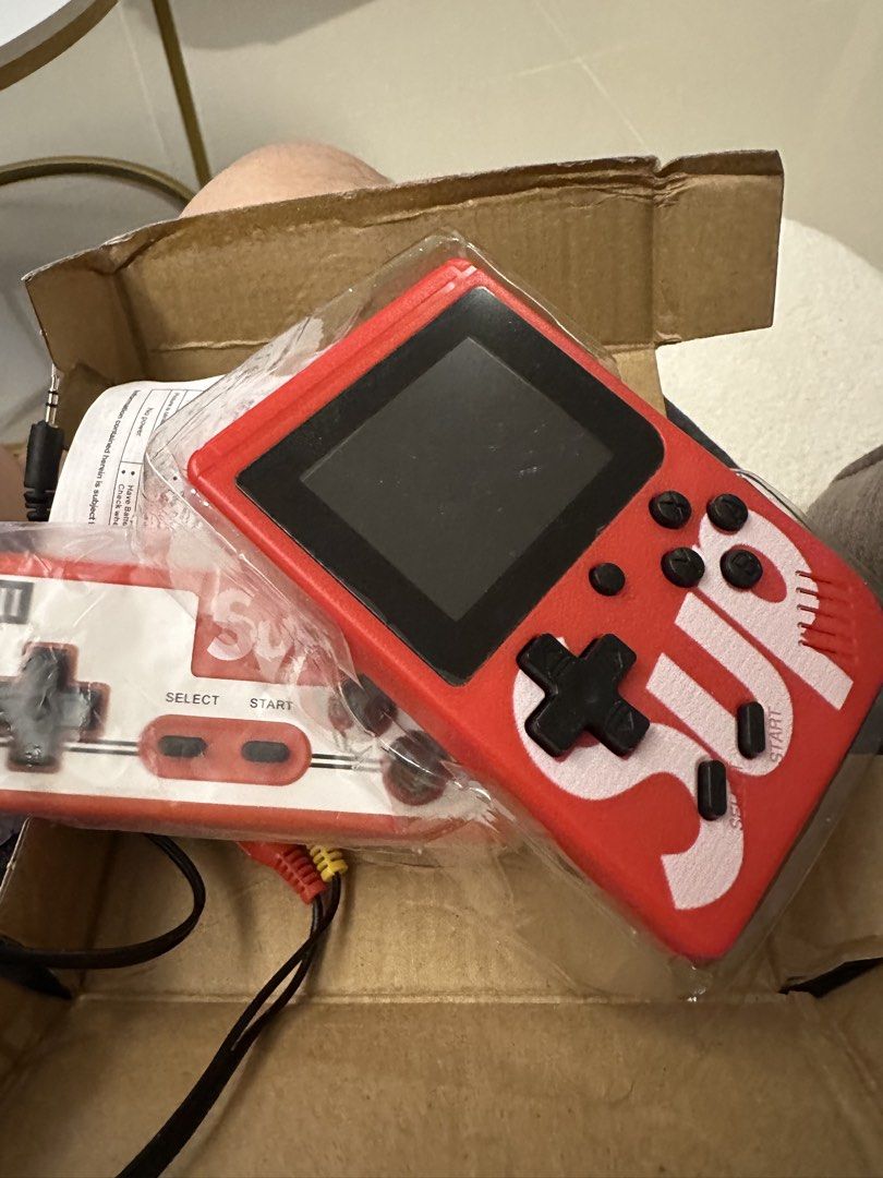 Sup Game Box 400 in 1 (Category: Nintendo) located in Quezon City. Submitted by smurkyjam23 (Listing ID 1422276979, Image 3). Description: - Sup Game Box Plus! - 400 built-in retro games. - Includes console, external gamepad, and AV cables. - Red console with Sup logo. - Supports 2-player gaming with external gamepad. - have not used for a year or so, on and off issue. Possibly need to change the battery.