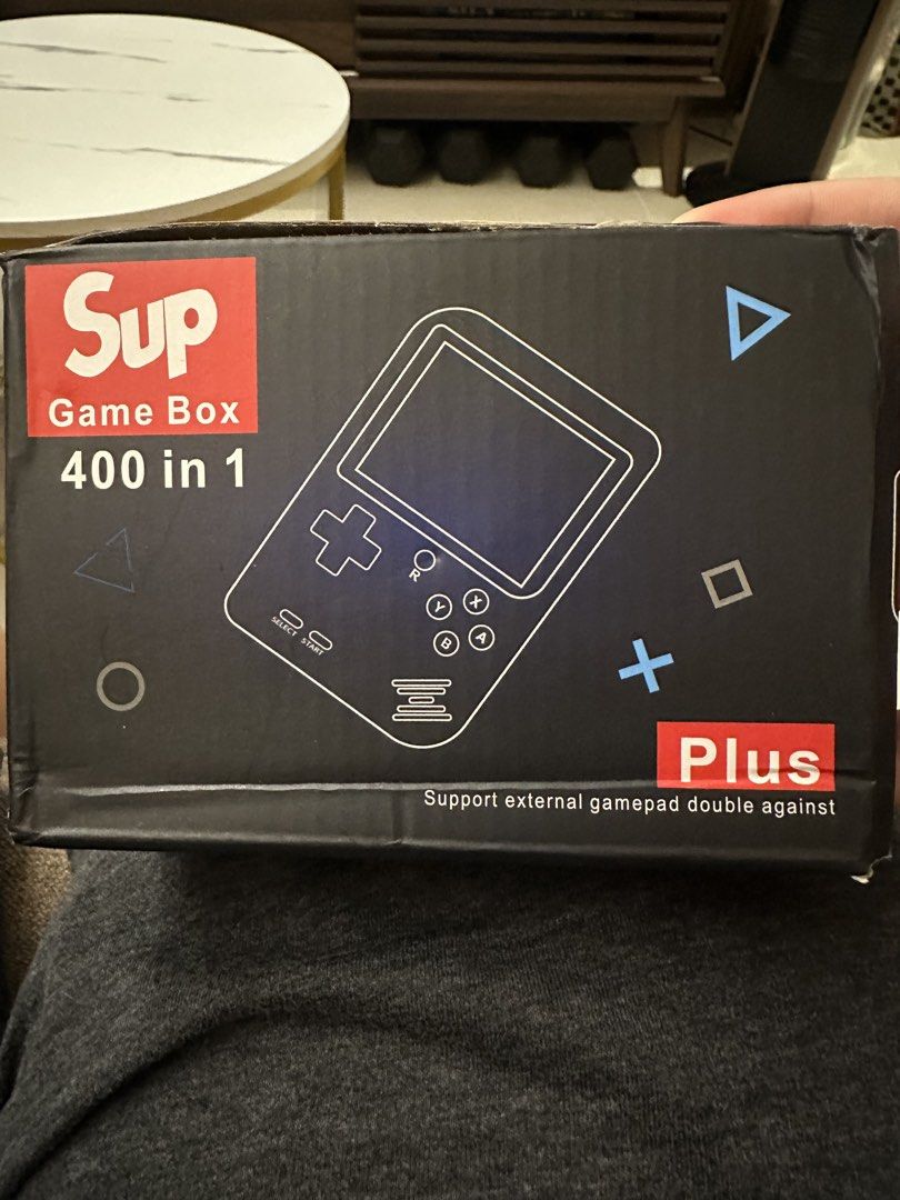 Sup Game Box 400 in 1 (Category: Nintendo) located in Quezon City. Submitted by smurkyjam23 (Listing ID 1422276979, Image 1). Description: - Sup Game Box Plus! - 400 built-in retro games. - Includes console, external gamepad, and AV cables. - Red console with Sup logo. - Supports 2-player gaming with external gamepad. - have not used for a year or so, on and off issue. Possibly need to change the battery.