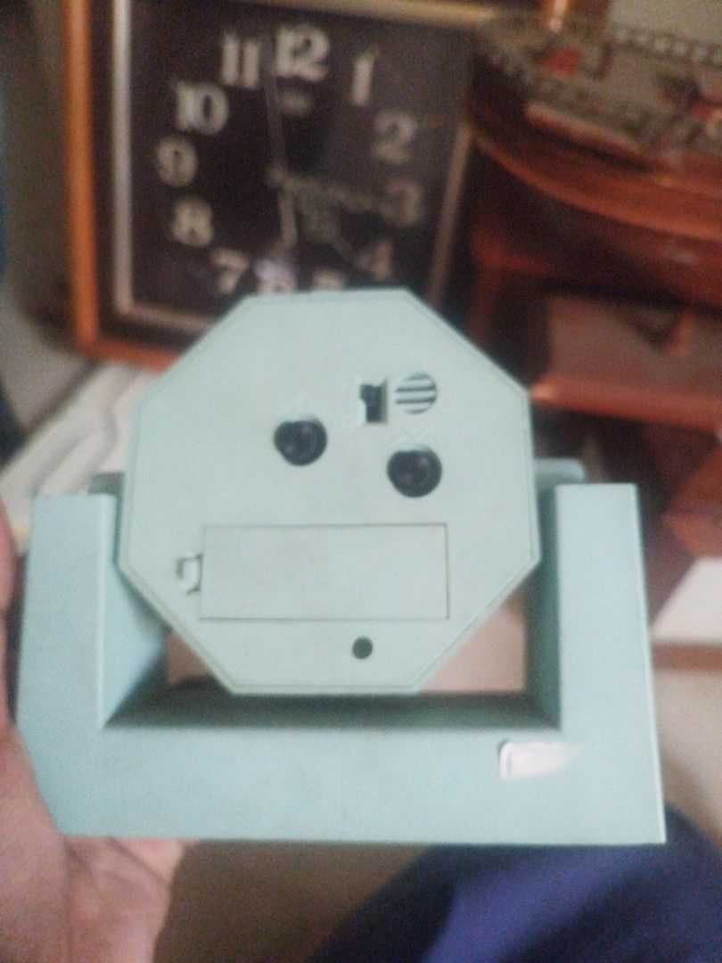 Vintage Bear Alarm Clock (Category: Clocks) located in San Rafael. Submitted by jflshoppe1989 (Listing ID 1422300327, Image 2). Description: - Vintage alarm clock - Octagonal light blue frame - Cream-colored clock face - Large, easy-to-read numbers - Cute bear graphic - Includes stand - Battery compartment at the back - In good working condition.