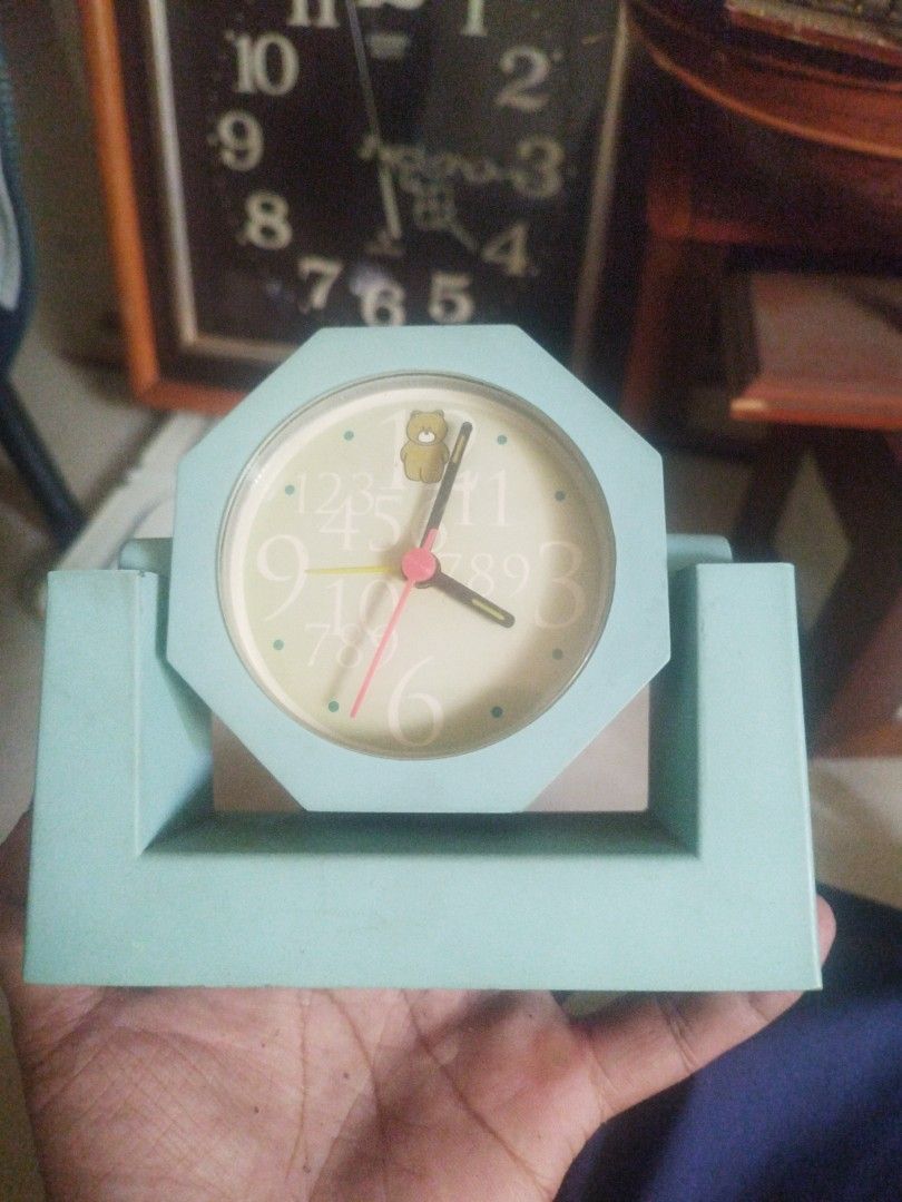 Vintage Bear Alarm Clock (Category: Clocks) located in San Rafael. Submitted by jflshoppe1989 (Listing ID 1422300327, Image 1). Description: - Vintage alarm clock - Octagonal light blue frame - Cream-colored clock face - Large, easy-to-read numbers - Cute bear graphic - Includes stand - Battery compartment at the back - In good working condition.