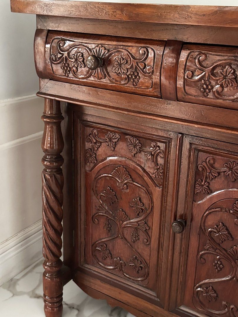 Vintage SOLID NARRA buffet cabinet with ornate carvings and twisted posts (Category: Shelves, Cabinets & Racks) located in Antipolo. Submitted by mrs_rp (Listing ID 1422339861, Image 2). Description: Vintage solid narra buffet cabinet with intricate carvings. The posts are twisted design. In very good, like new condition. L=54.25” W=15.75” H=33.50”.