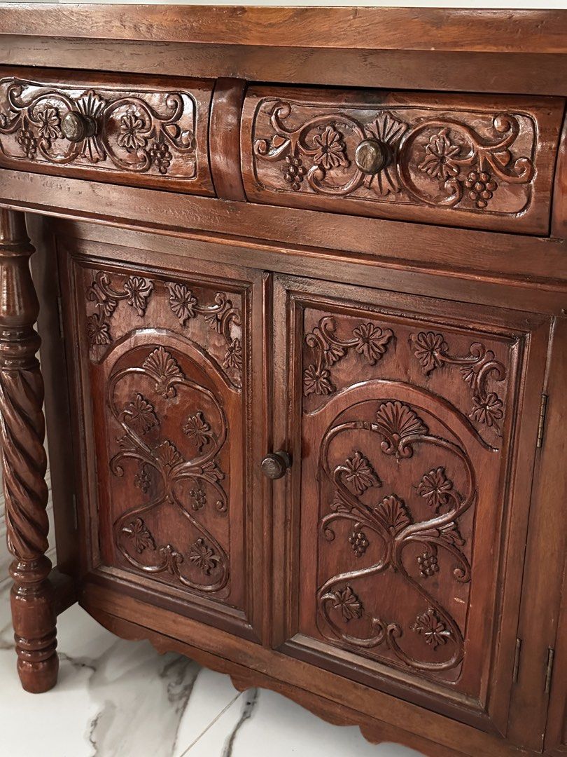 Vintage SOLID NARRA buffet cabinet with ornate carvings and twisted posts (Category: Shelves, Cabinets & Racks) located in Antipolo. Submitted by mrs_rp (Listing ID 1422339861, Image 3). Description: Vintage solid narra buffet cabinet with intricate carvings. The posts are twisted design. In very good, like new condition. L=54.25” W=15.75” H=33.50”.