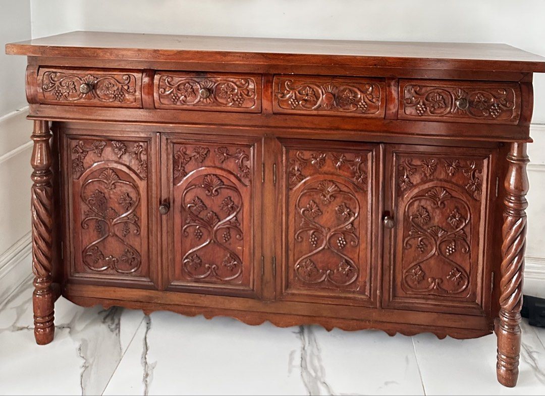 Vintage SOLID NARRA buffet cabinet with ornate carvings and twisted posts (Category: Shelves, Cabinets & Racks) located in Antipolo. Submitted by mrs_rp (Listing ID 1422339861, Image 1). Description: Vintage solid narra buffet cabinet with intricate carvings. The posts are twisted design. In very good, like new condition. L=54.25” W=15.75” H=33.50”.