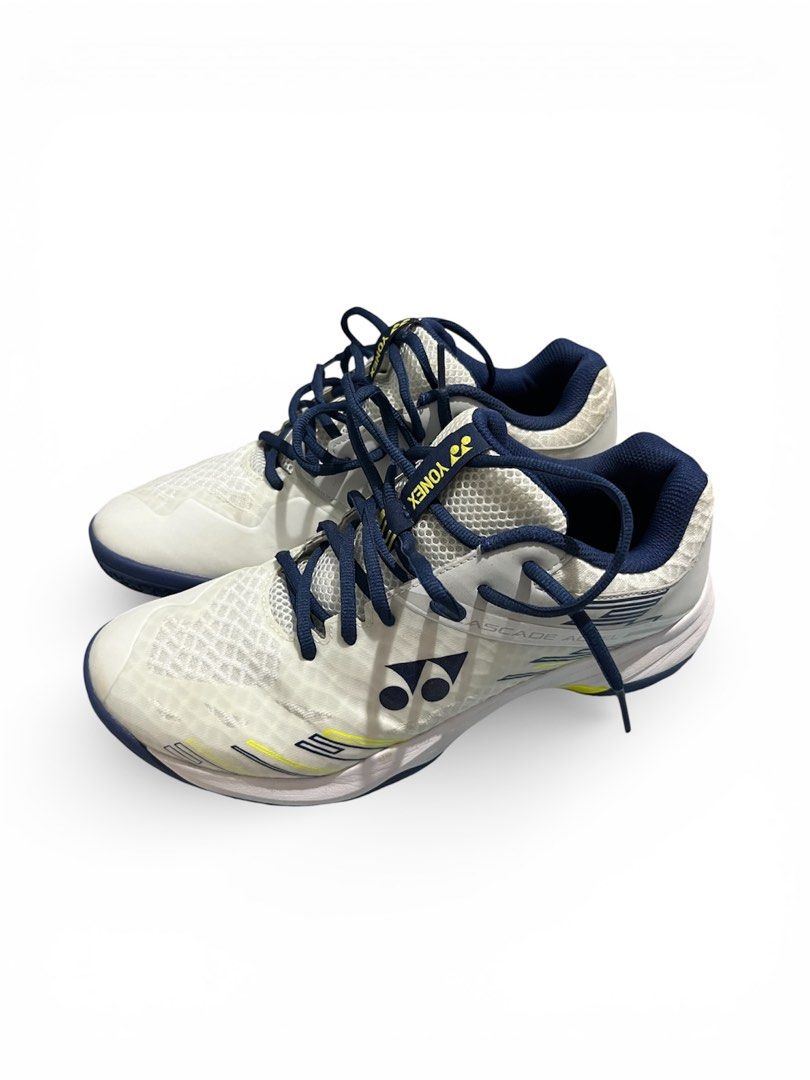 Yonex Cascade Accel Badminton Shoes (Category: Sneakers) located in Batangas. Submitted by thrift.with.okiks (Listing ID 1422355295, Image 3). Description: - Yonex Cascade Accel badminton shoes - Color: White, yellow, and navy blue - Mesh upper for breathability - Durable sole for grip - Yonex logo visible.