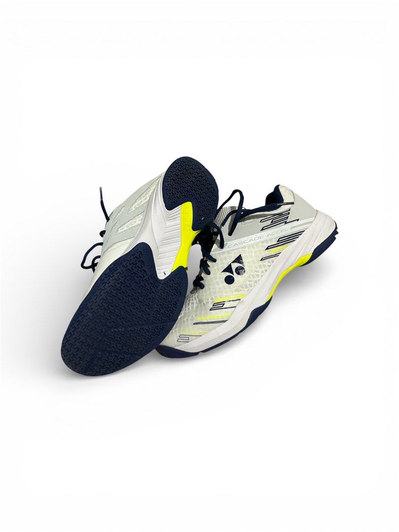 Yonex Cascade Accel Badminton Shoes (Category: Sneakers) located in Batangas. Submitted by thrift.with.okiks (Listing ID 1422355295, Image 2). Description: - Yonex Cascade Accel badminton shoes - Color: White, yellow, and navy blue - Mesh upper for breathability - Durable sole for grip - Yonex logo visible.
