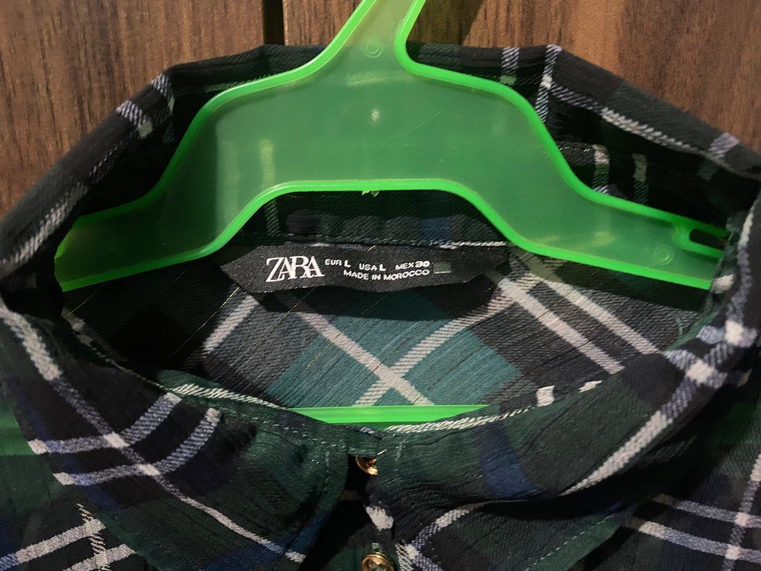 Zara Plaid Shirt - Size L (Category: Shirts) located in Antipolo. Submitted by MindMunch (Listing ID 1422337409, Image 2). Description: - Zara plaid shirt (checkered, flannel) - Size: L - Colors: Green, black, white - Made in Morocco - Features: Collared neckline, button-down closure, long sleeves with buttoned cuffs, two chest pockets.