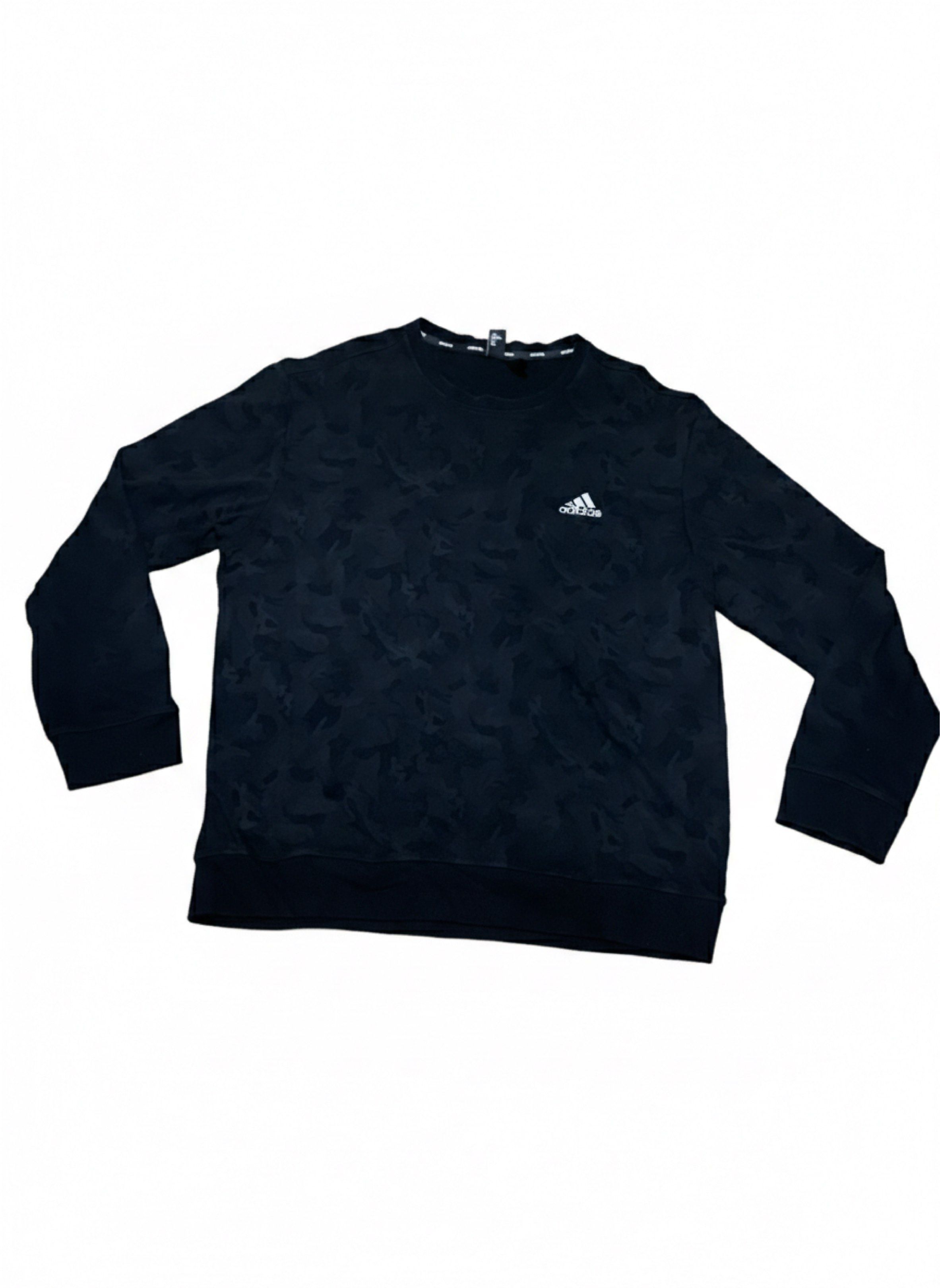 Adidas Camo Crewneck Sweatshirt (Category: Coats, Jackets and Outerwear) located in Cavite. Submitted by jamstore89 (Listing ID 1419365956, Image 1). Description: Fs Black Adidas crewneck sweatshirt with a camo pattern. Size : Xl Dimes : 24x28" Location: paranaque P500 Features the Adidas logo on the chest. The tag shows the Adidas logo and other details. The sweatshirt has a ribbed collar, cuffs, and hem..
