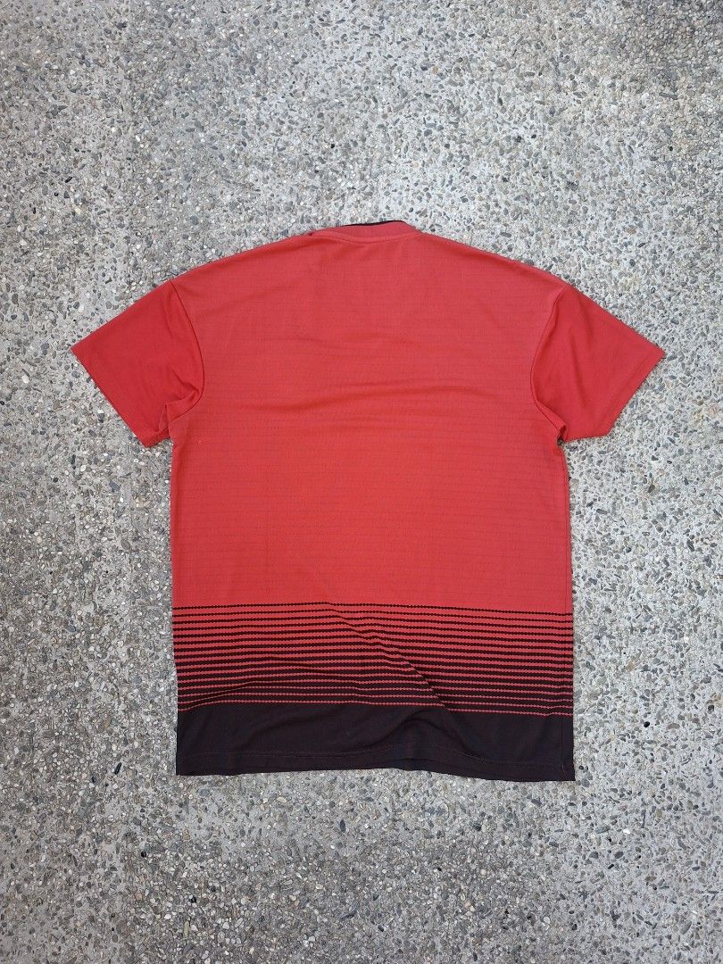 Adidas Manchester United Jersey (Category: Activewear) located in Marikina City. Submitted by 2nd_chancedrips (Listing ID 1419197096, Image 3). Description: -authentic -21.5 x 26.5 -m on tag -crackprints Red Manchester United jersey with the Chevrolet logo. It features the Adidas logo and the Manchester United crest. The jersey has black stripes on the shoulders and a black collar. The tag indicates the jersey was made in 04/18. The material comp