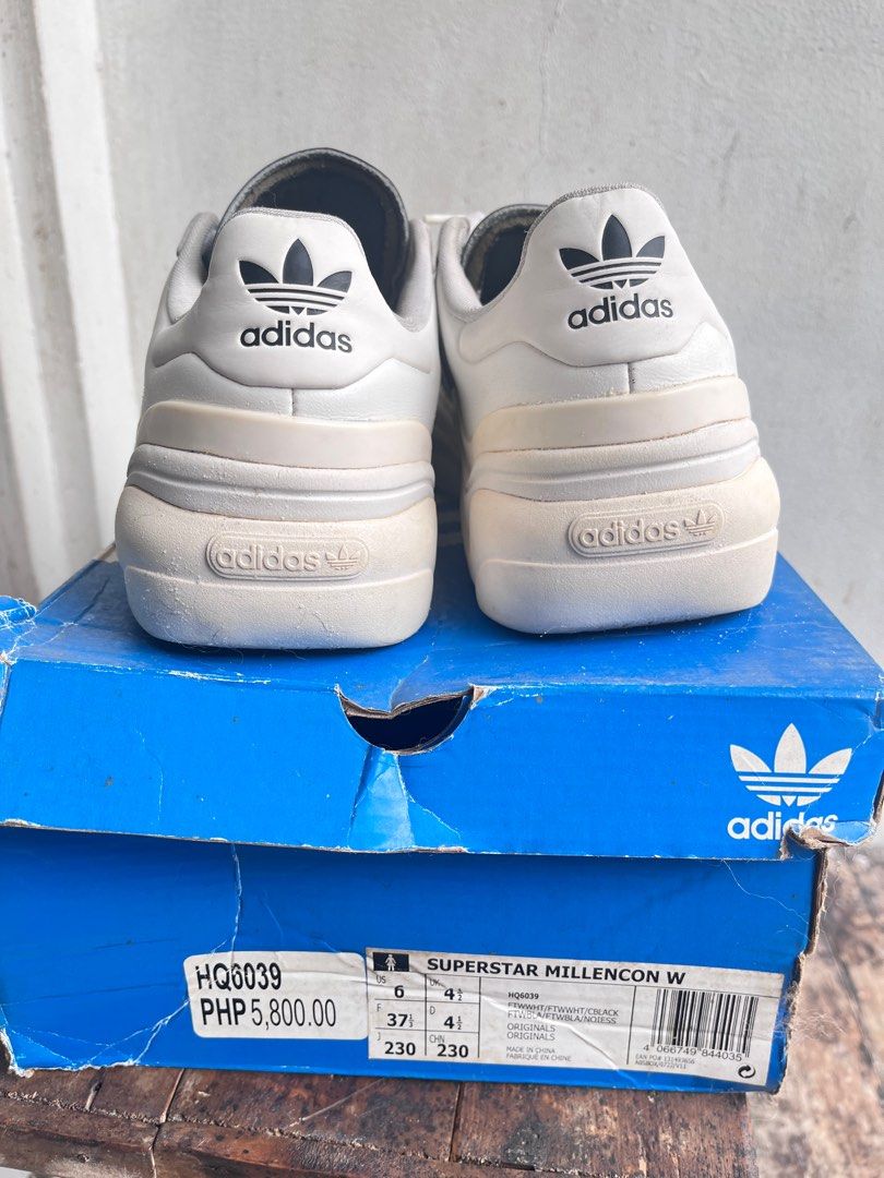 Adidas Superstar Millencon W Sneakers (Category: Sneakers) located in Pasig City. Submitted by wangderfulworld (Listing ID 1419221513, Image 3). Description: - Adidas Superstar Millencon W Sneakers - Authentic, bought in Podium - White with black accents - Size: US 6, EUR 37 1/2, 23cm - Includes original box - Classic Adidas stripes - Soles show some wear - Box has some wear and tear - Orig price (₱5,800).