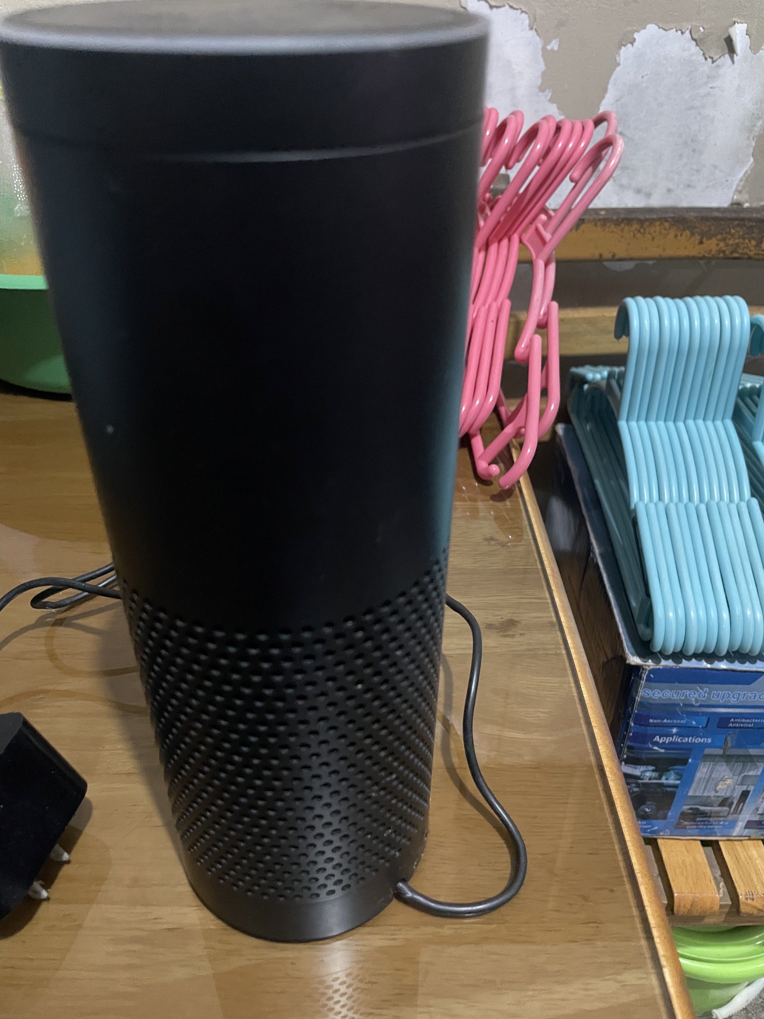Amazon Echo (Category: Soundbars, Speakers & Amplifiers) located in Manila. Submitted by cosmiccloud-adf7 (Listing ID 1419256186, Image 3). Description: - Amazon Echo smart speaker - Color: Black - Includes power adapter - Features top buttons and microphone icon - Cylindrical design - Fabric-like texture on the bottom half.