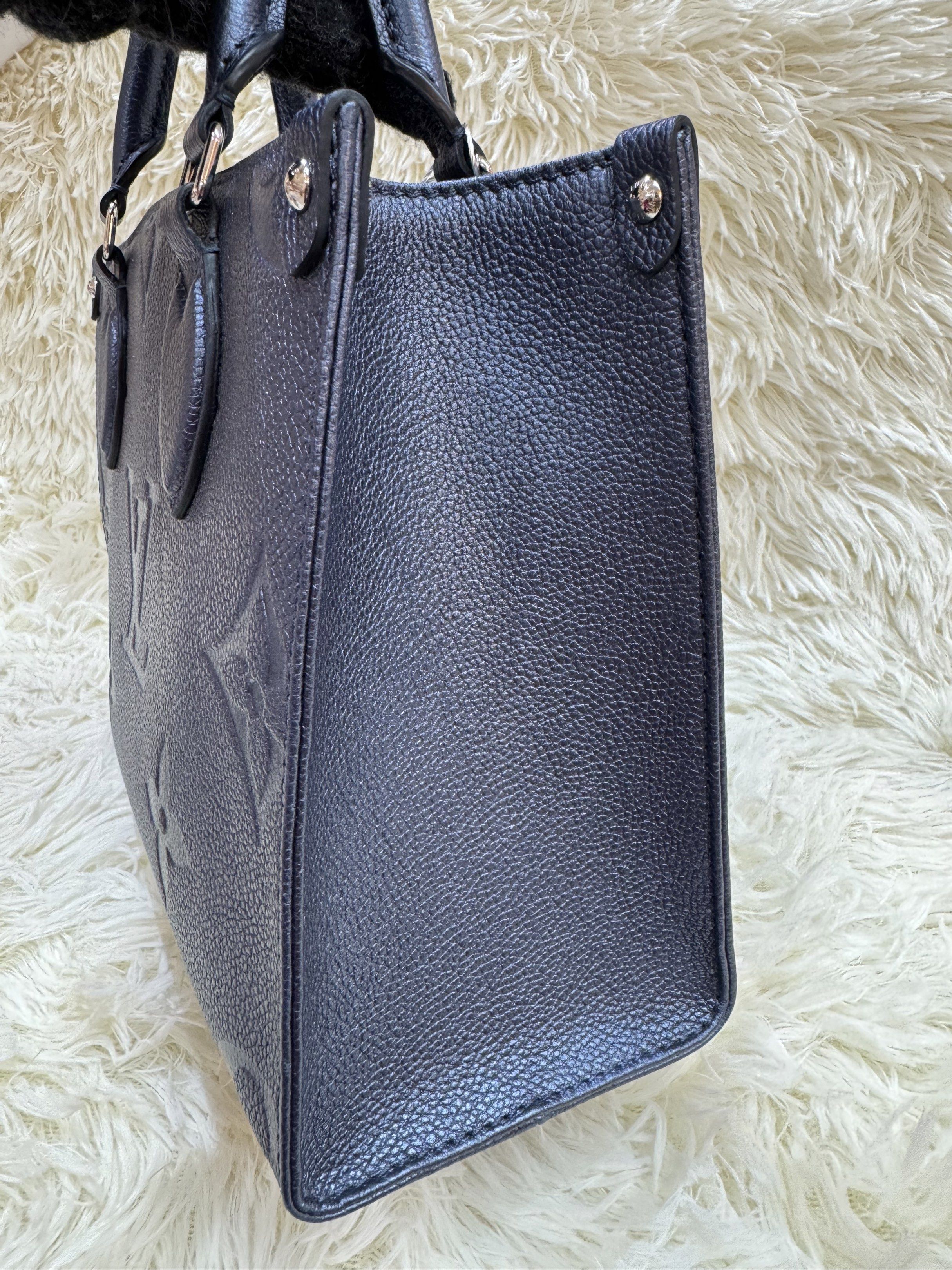 Authentic Louis Vuitton (Category: Luxury Bags & Wallets) located in Manila. Submitted by chloe_luxuries (Listing ID 1419230765, Image 2). Description: Guaranteed Original Louis Vuitton OTG In Navy Nacre Monogram pm size Still in excellent condition Comes with strap dustbag and box Pm for those interested .