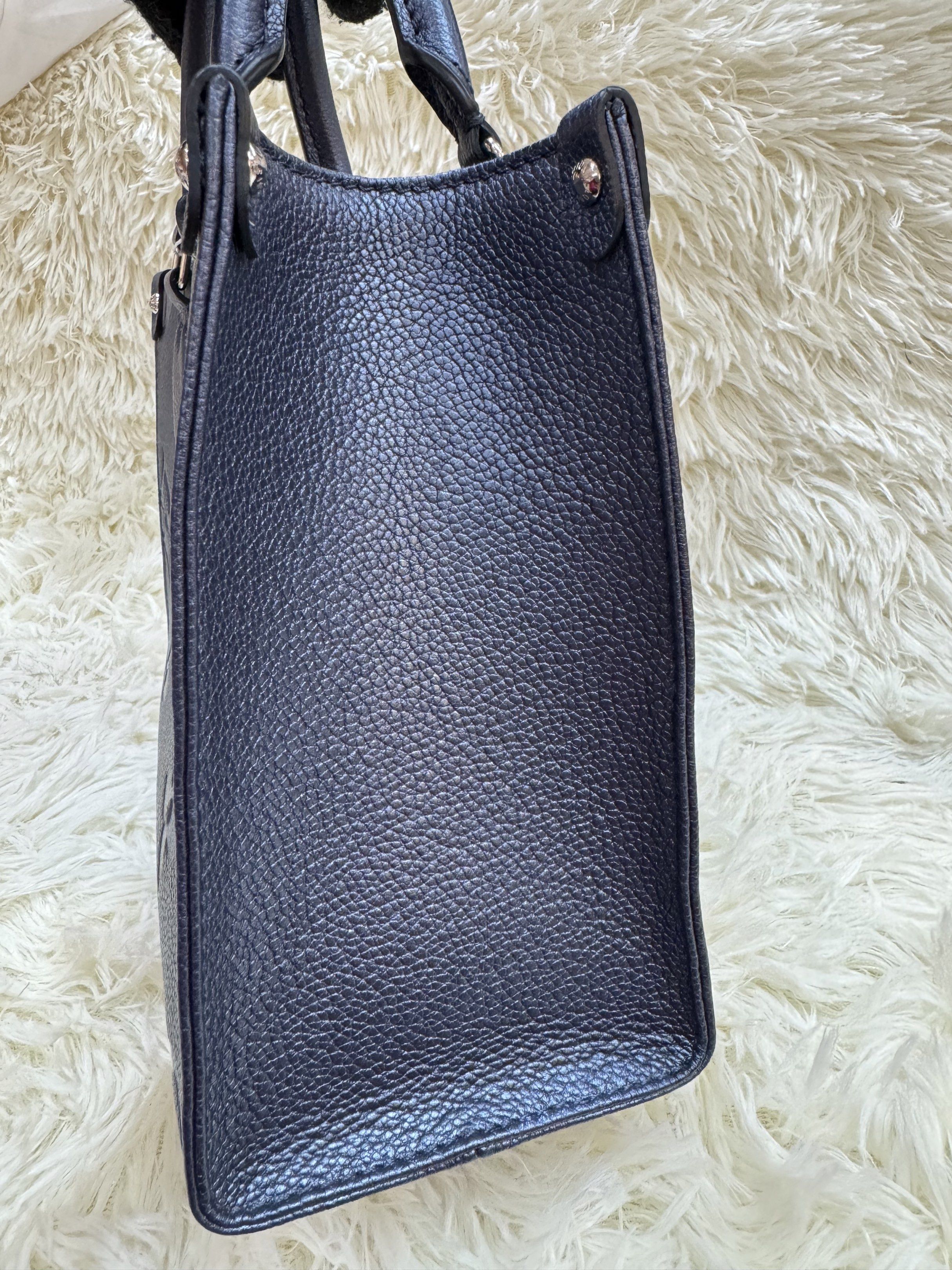 Authentic Louis Vuitton (Category: Luxury Bags & Wallets) located in Manila. Submitted by chloe_luxuries (Listing ID 1419230765, Image 3). Description: Guaranteed Original Louis Vuitton OTG In Navy Nacre Monogram pm size Still in excellent condition Comes with strap dustbag and box Pm for those interested .