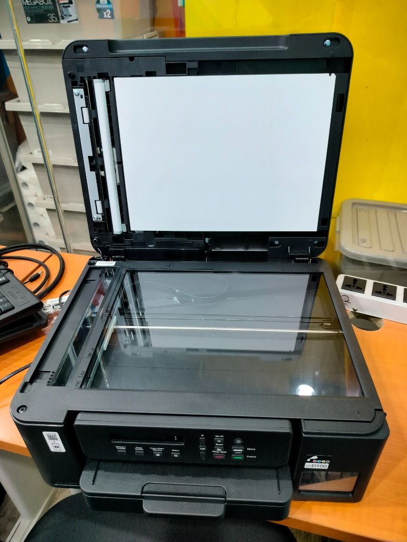 Brother DCP-T720DW Ink Tank Printer (Category: Printers, Scanners & Copiers) located in Manila. Submitted by msadlawan646634 (Listing ID 1419253557, Image 2). Description: Multifunction printer, inkjet printer with scanning and copying capabilities, Flatbed scanner for scanning and copying documents. Paper output tray at the front. Ink tank window on the right side, suggesting it may be a refillable ink tank model..