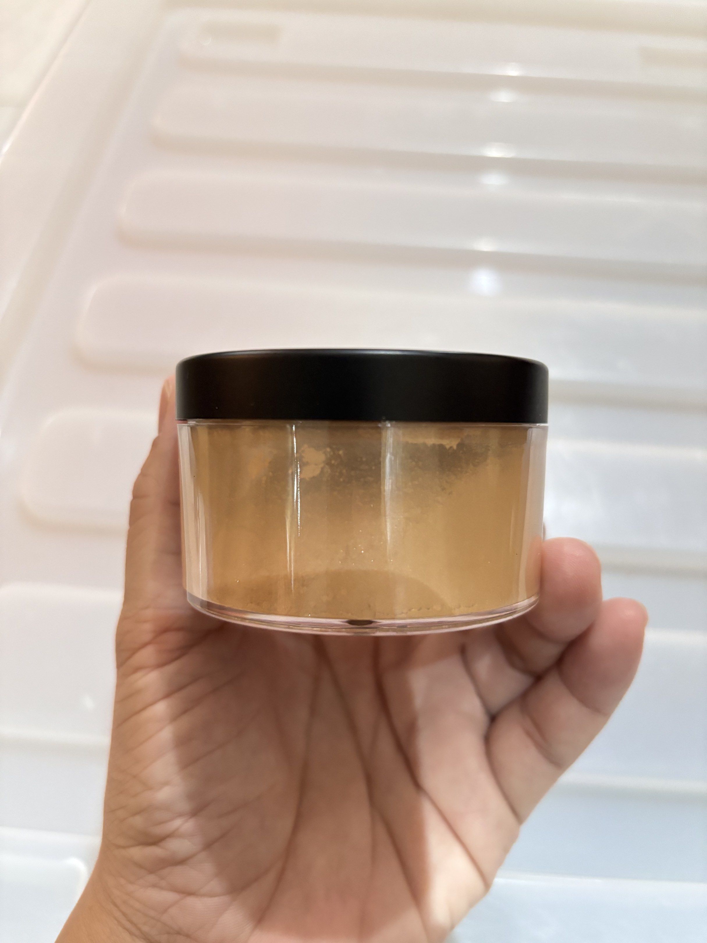 BYS Shimmer Setting Powder - Stardust (Category: Makeup) located in Concepcion. Submitted by cherishedthreads (Listing ID 1419255991, Image 2). Description: - BYS Shimmer Setting Powder in Stardust - Loose powder for a shimmering finish - 0.74 oz / 21g of product - Comes in a clear container with a black lid - Golden color.