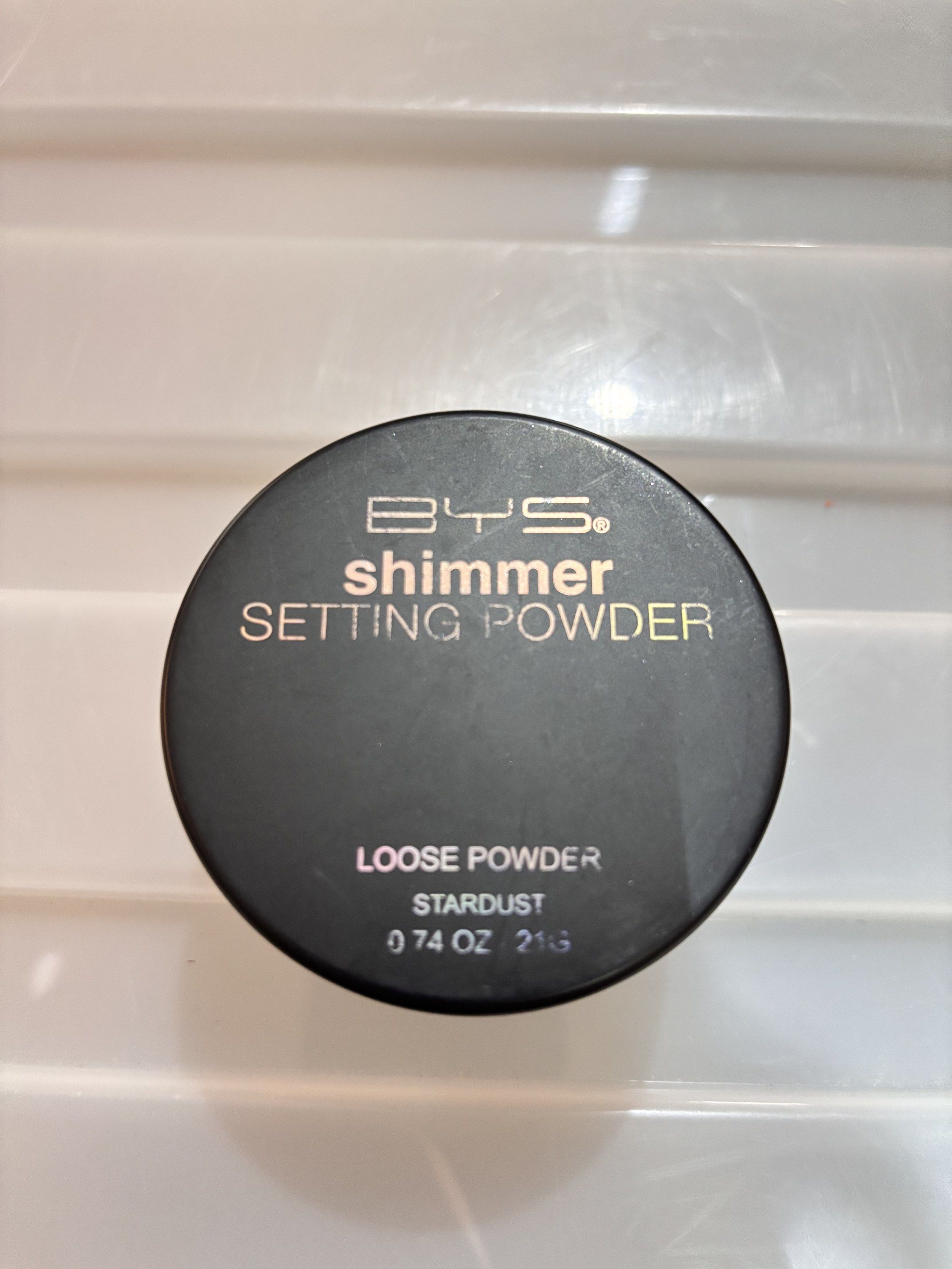BYS Shimmer Setting Powder - Stardust (Category: Makeup) located in Concepcion. Submitted by cherishedthreads (Listing ID 1419255991, Image 1). Description: - BYS Shimmer Setting Powder in Stardust - Loose powder for a shimmering finish - 0.74 oz / 21g of product - Comes in a clear container with a black lid - Golden color.