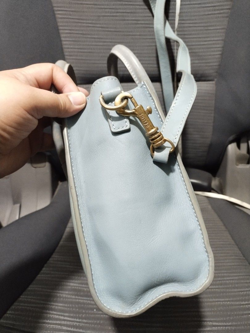 celine nano 2way handbag slingbag (Category: Luxury Bags & Wallets) located in Baguio. Submitted by roozeydluc (Listing ID 1419297169, Image 2). Description: leather material nearly medium size L:7.6" W:3.7" H:7.7" 🔎mga bakbak sa inner lining 🔎 discoloration sa sides & sa handle 🔎deep rubs sa edges ng base & dulo ng handle ✓1 zippered compartment with 1 zippered inside pocket ✓1 zippered front pocket.