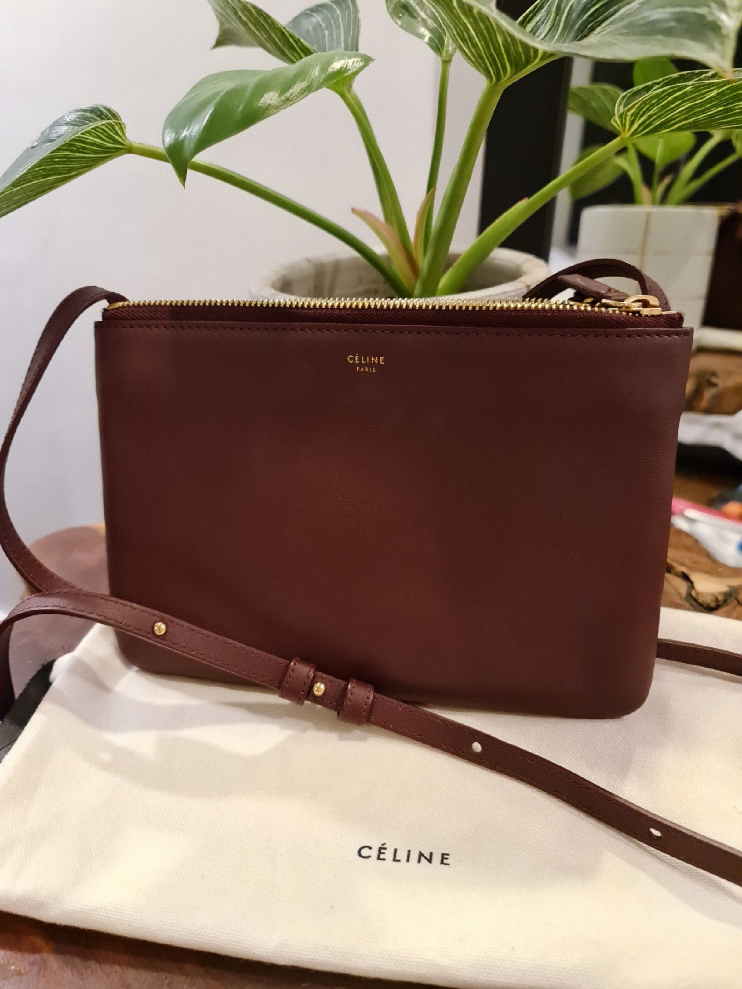 Celine Trio Bag (Category: Luxury Bags & Wallets) located in Paranaque City. Submitted by helloasher (Listing ID 1419254477, Image 2). Description: - Celine Trio bag - Burgundy leather - Gold zipper - Detachable strap - Includes dust bag - Celine logo visible.